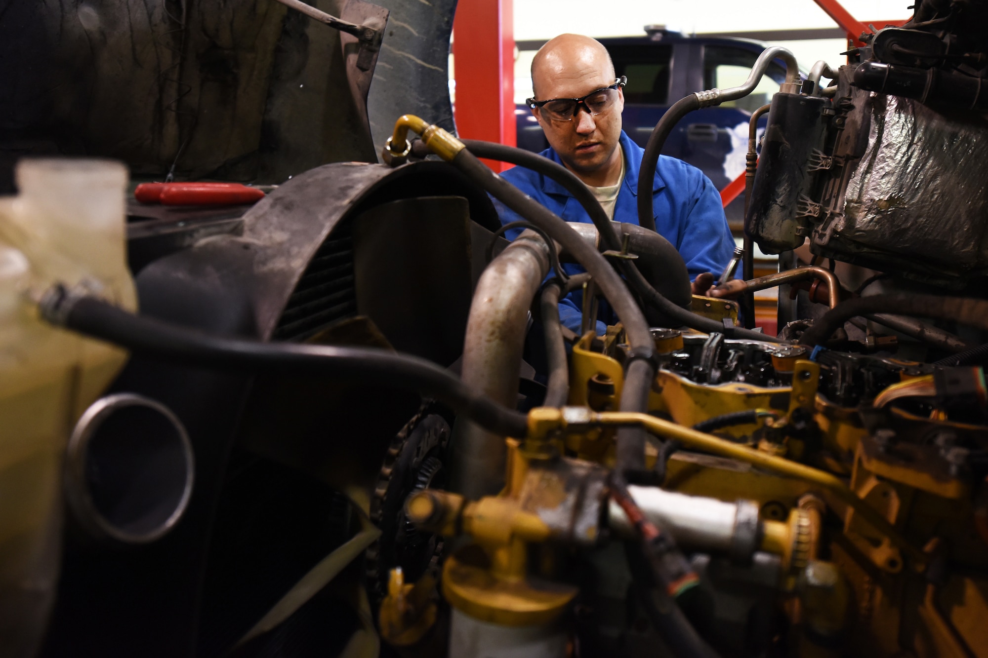Staff Sgt. Rock Conley, 341st Logistics Readiness Squadron truck and tractor shop vehicle mechanic, works on a maintenance van engine July 27, 2015, at Malmstrom Air Force Base, Mont. The shop upholds a 96.8 percent of maintenance vans available to do the base mission. (U.S. Air Force photo/Chris Willis)