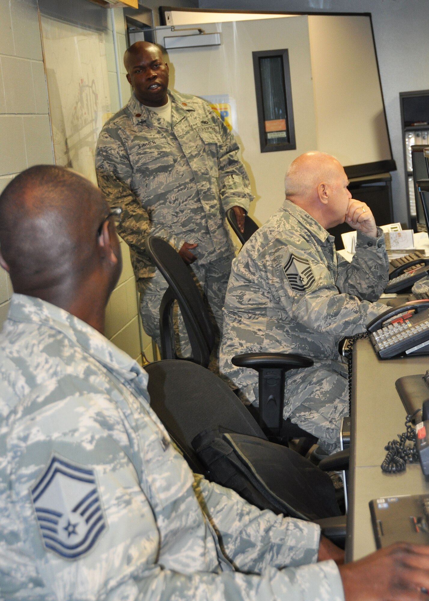 Major Cedric Finnen, 944th Logistics Readiness Squadron, Vehicle Maintenance Flight commander and Operation Patriot Angler deployment commander discusses operations with Senior Master Sgt. James Lindsay, 944th LRS, noncommissioned officer in charge of Plans and deployment project officer.  This is the first squadron deployment with the 944th LRS for Finnen who has been with the wing for right at two years.