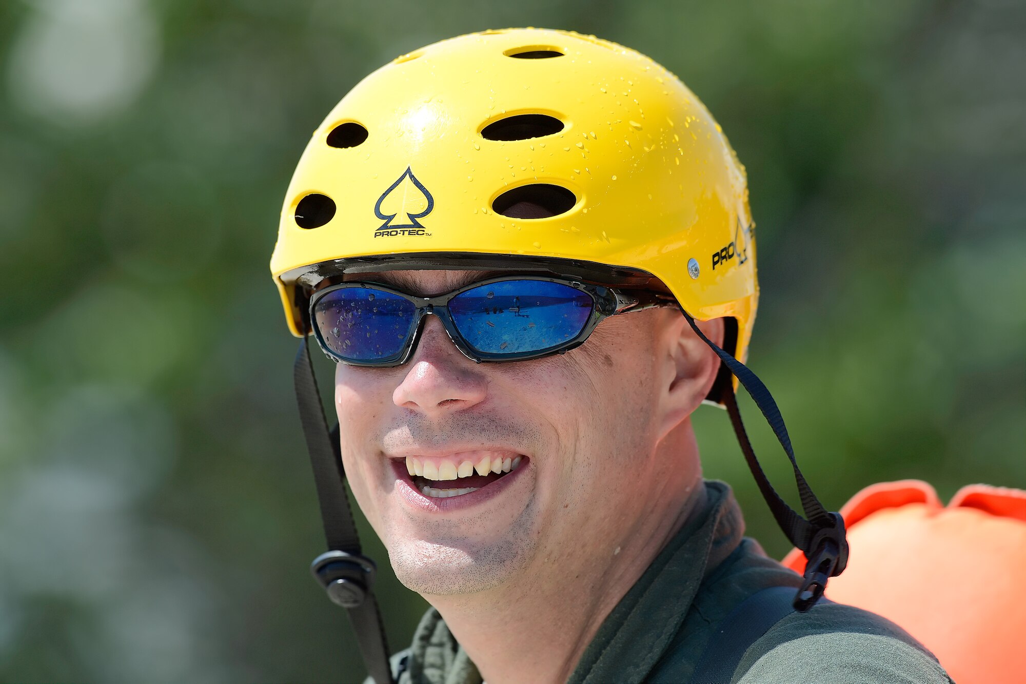 Technical Sgt. Jason Massey, 3d Airlift Squadron C-17A Globemaster III loadmaster, smiles after successfully completing a water survival refresher training event in the Delaware Bay in a class conducted by the 436th Operations Support Squadron Survival, Evasion, Resistance and Escape Operations, July 17, 2015, near Dover Air Force Base, Del.  The C-5M Super Galaxy and C-17A Globemaster III aircrew of the 436th Airlift Wing and the 512th Airlift Wing completed the training which is required every three years. (U.S. Air Force photo/Greg L. Davis)