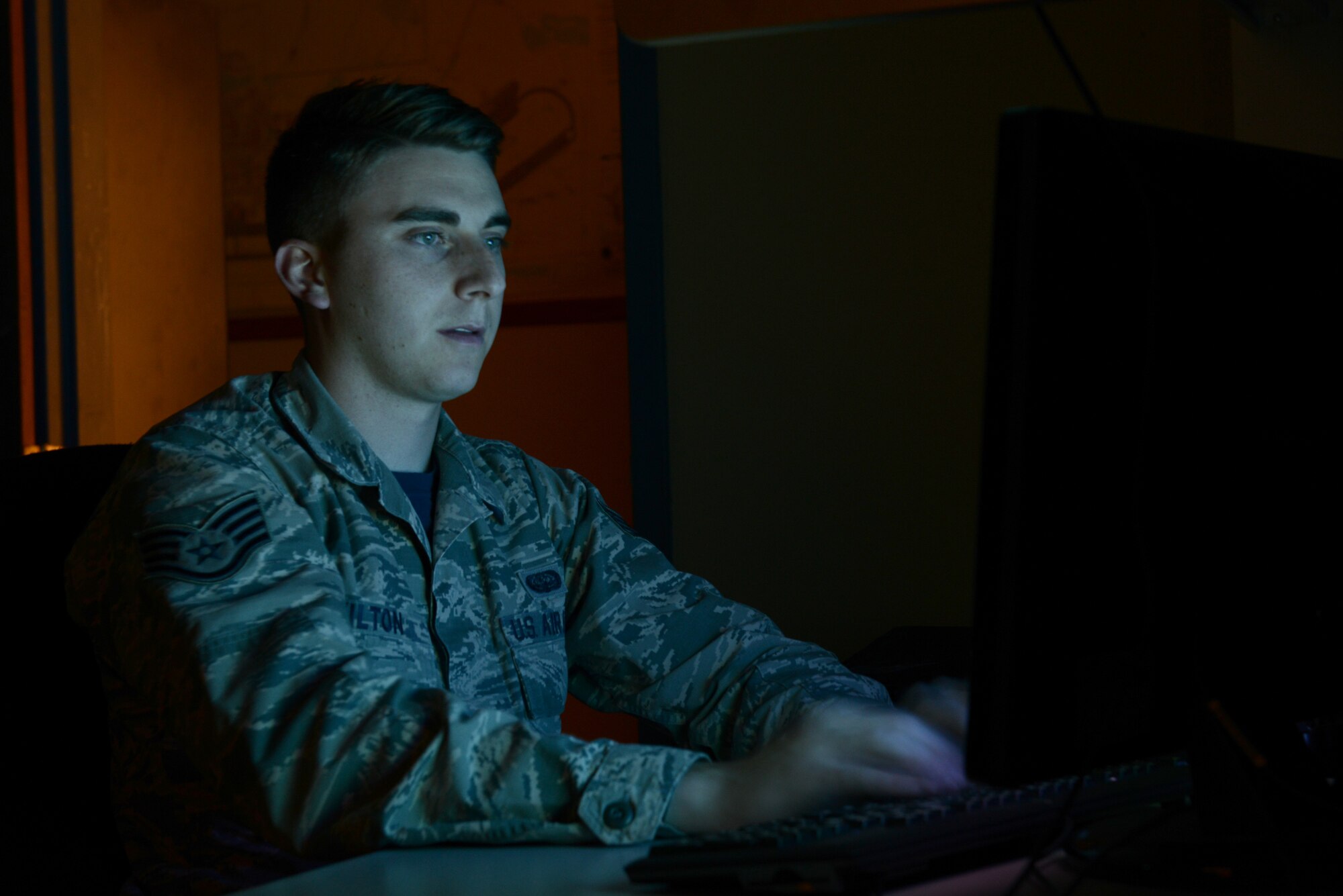 U.S. Air Force Staff Sgt. Jeremiah Skilton, the 354th Communications Squadron NCO in-charge of client systems, logs into a computer’s basic input/output system July 24, 2015, at Eielson Air Force Base, Alaska. Skilton and other members of his shop perform customer requests, assess and repair damaged computers. (U.S. Air Force photo by Senior Airman Ashley Nicole Taylor/Released)