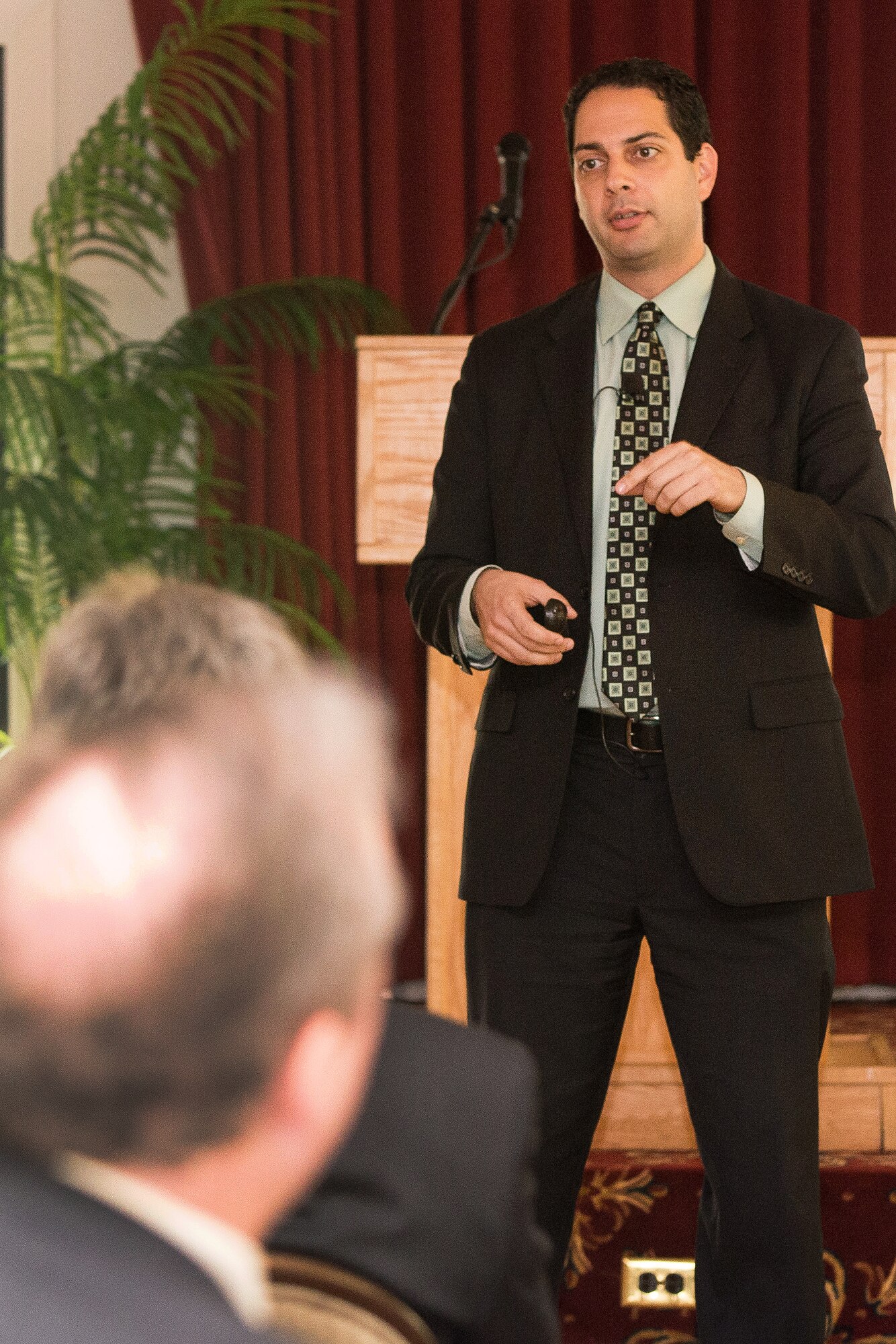 Dr. Camron Gorguinpour, director of Transformational Innovation, Office of the Assistant Secretary of the Air Force for Acquisitions, addresses industry members during a Hanscom Representatives Association meeting at Minuteman Commons on Hanscom Air Force Base, Mass., July 27. Gorguinpour spoke about innovative approaches to defense acquisition, including how technology can potentially contribute. His topics ranged from where innovation could be used, such as in open systems and cost capability analyses, to new initiatives such as acquisition cognitive computing and challenge-based acquisitions. (U.S. Air Force photo by Mark Herlihy)