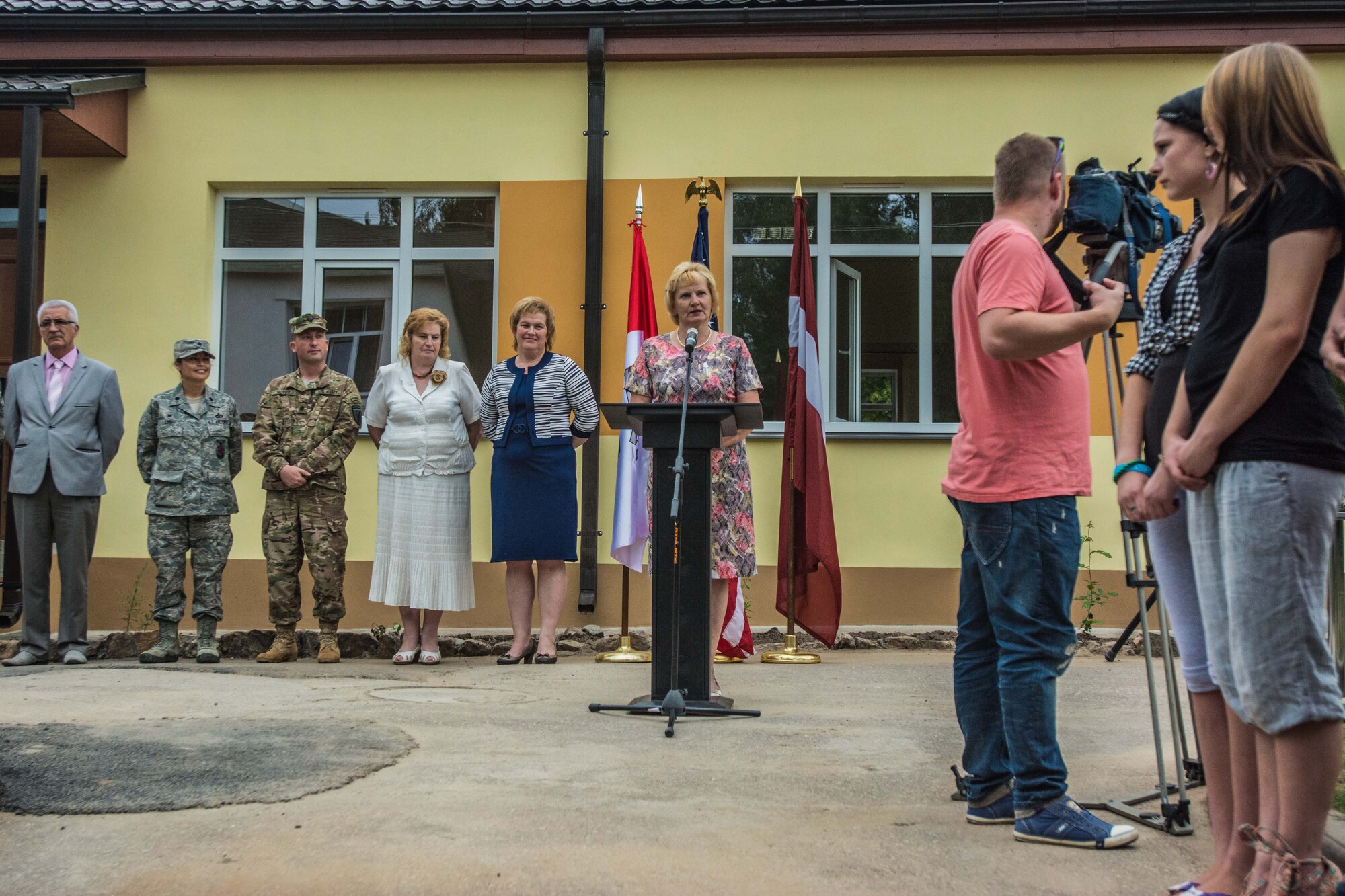 Janina Jalinska, head of Daugavpils Regional Council, speaks during the ribbon-cutting ceremony of a newly reconstructed building of the Naujenu Orphanage near Daugavpils, Latvia, July 23, 2015.  Various U.S. Air National Guard units and Latvian National Armed Forces were participating in the Humanitarian Civic Assistance project through the United States European Command, that pairs units training requirements with humanitarian needs.   (U.S. Air Force photo by Senior Airman Patrick P. Evenson/Released)