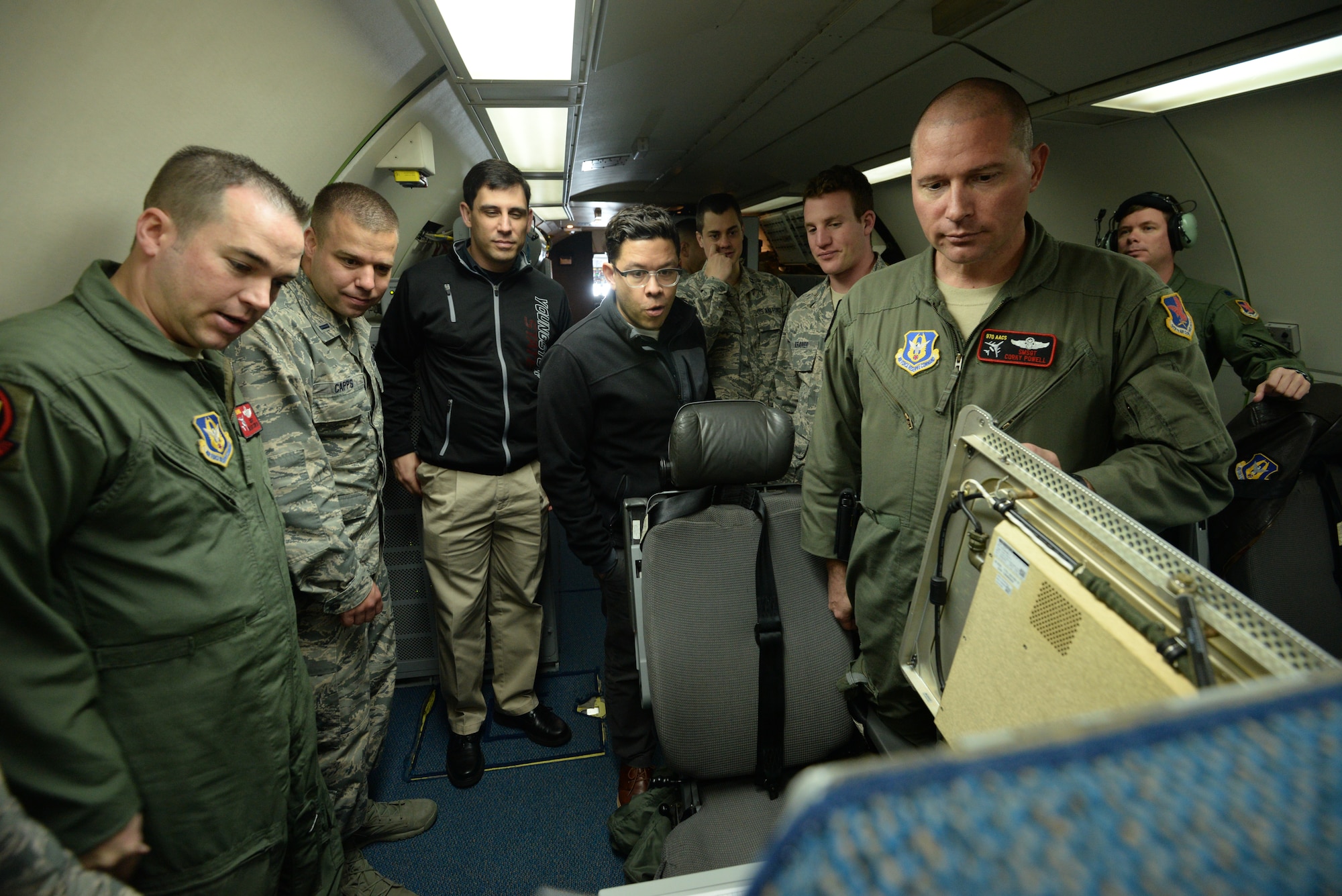 Senior Master Sgts. Malachi Sturlin (left) and Courtney Powell (right), computer and display maintenance technicians assigned to the 970th Airborne Air Control Squadron, showcase upgraded computer hardware on board an E-3G Sentry Block 40/45 to program managers on July 18 during a training mission. The 513th Air Control Group invited eight program managers on board to see the product of their work and to discuss future improvements to the Airborne Warning and Control System aircraft. (U.S. Air Force photo by Staff Sgt. Caleb Wanzer)