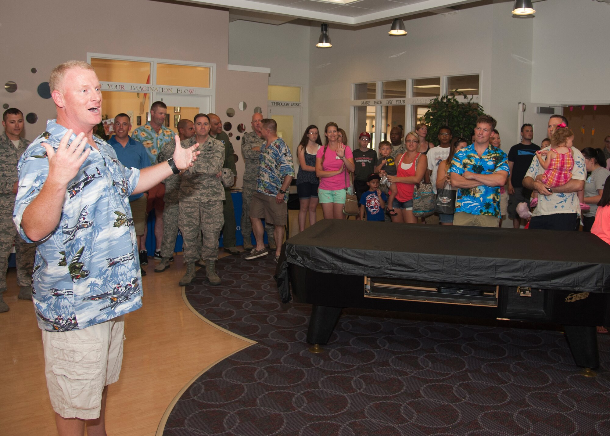 Col. Charles Nesemeier, 436th Maintenance Group commander, welcomes the families to the Deployed Families Dinner July 23, 2015, at the Youth Center on Dover Air Force Base, Del. Food, games, activities and prizes were available for those who attended. (U.S. Air Force photo/Senior Airman Jared Duhon)