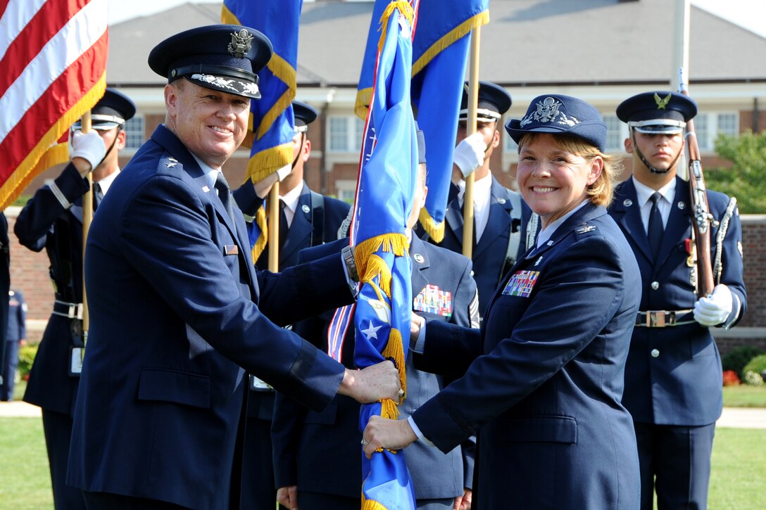 Col. Sharon R. Bannister accepts command of the 79th Medical Wing from Maj. Gen. Darryl W. Burke, Commander of the Air Force District of Washington  on Tuesday, July 28, at 9 a.m. at the Ceremonial Lawn on Joint Base Anacostia-Bolling, Washington, District of Columbia.  (Photo by Staff Sgt. Matthew Davis, AFDW PA)
