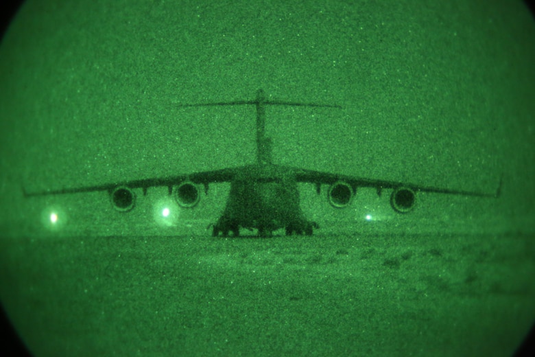 A C-17 Globemaster taxis after being guided in for landing by the 321st Contingency Response Element aboard Al Taqaddum Air Base, Iraq, July 1, 2015. The 321st brings with it all the necessary elements for expeditionary airfield operations such as air traffic control, aerial porters and security forces who were instrumental in helping the Special Purpose Marine Air-Ground Task Force-Crisis Response-Central Command with the establishment of Task Force Al Taqaddum. (U.S. Marine Corps photo by Cpl. John Baker / RELEASED)