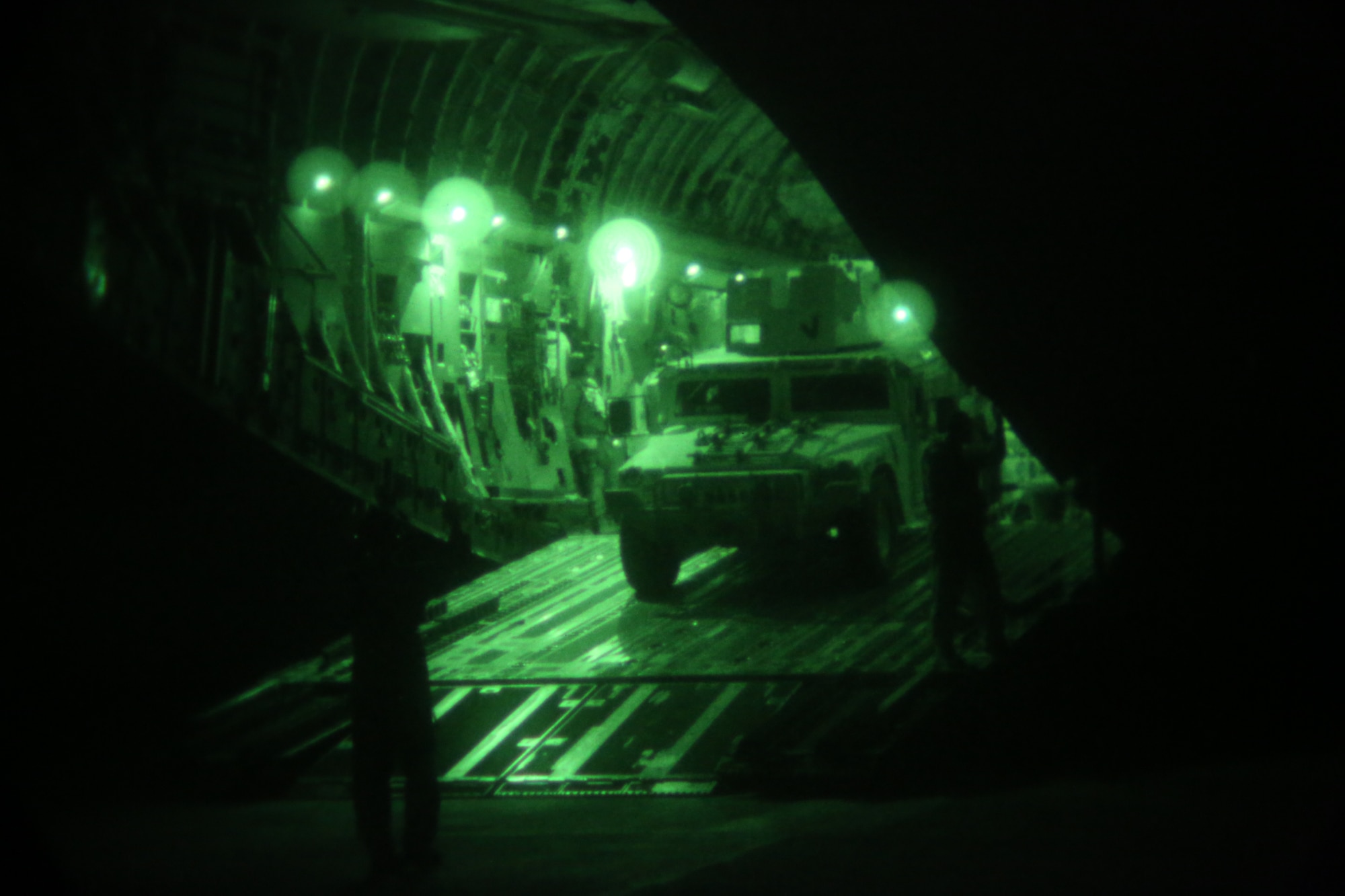 U.S. Airmen with 321st Contingency Response Element offload a Humvee from a C-17 Globemaster at Al Taqaddum Air Base, Iraq, July 1, 2015. The 321st also has the capability to offload pallets up to 10,000 pounds using a forklift and can offload up to three pallets at a time using the 25k Halverson loader, during expeditionary airfield operations. (U.S. Marine Corps photo by Cpl. John Baker / RELEASED)