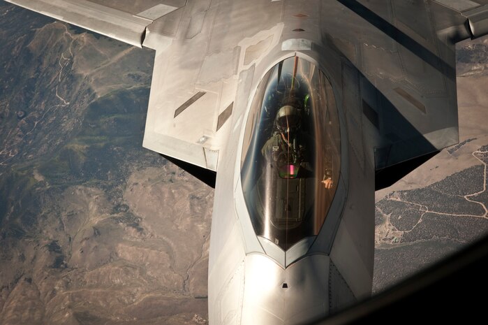 An F-22 Raptor pilot from the 325th Fighter Squadron, Tyndall Air Force Base, Fla.,  maneuvers his aircraft into position to refuel off the tail of a KC-135 Stratotanker assigned to the 344th Air Refueling Squadron, McConnell Air Force Base, Kan., during a Red Flag 15-3 training sortie over the Nevada Test and Training Range, July 24, 2015. The aircraft pictured was training on the side of Blue Force in the scenario, working against air, space, and cyber threats presented by members of the 57th Adversary Tactics Group. (U.S. Air Force photo by Senior Airman Joshua Kleinholz)