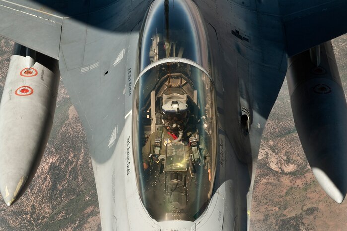 An F-16 Fighting Falcon pilot assigned to the 422nd Test and Evaluation Squadron, Nellis Air Force Base, Nev., holds his aircraft steady during aerial refueling off the tail of a KC-135 Stratotanker assigned to the 344th Air Refueling Squadron, McConnell Air Force Base, Kan., during a Red Flag 15-3 training sortie over the Nevada Test and Training Range, July 24, 2015. The Red Flag exercise was established in 1975 as one of the initiatives directed by Gen. Robert J. Dixon, then commander of Tactical Air Command, to better prepare our forces for combat. (U.S. Air Force photo by Senior Airman Joshua Kleinholz)