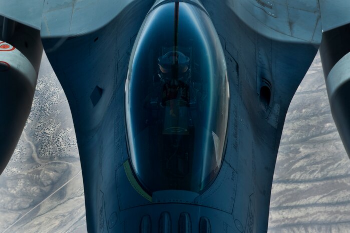 An F-16 Fighting Falcon pilot assigned to the 422nd Test and Evaluation Squadron, Nellis Air Force Base, Nev., holds his aircraft steady during aerial refueling off the tail of a KC-135 Stratotanker assigned to the 344th Air Refueling Squadron, McConnell Air Force Base, Kan., during a Red Flag 15-3 training sortie over the Nevada Test and Training Range, July 24, 2015. Red Flag is a realistic combat training exercise involving the air forces of the United States and its allies that maximizes the combat readiness and survivability of participants by providing a realistic training environment. (U.S. Air Force photo by Senior Airman Joshua Kleinholz)
