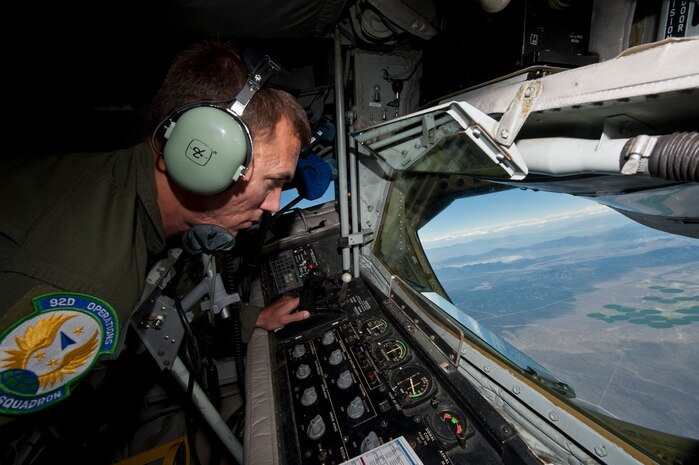 Tech. Sgt. Chris Joyce, a boom operator assigned to the 92nd Air Refueling Wing, Fairchild Air Force Base, Wash., refuels an aircraft during a Red Flag 15-3 training mission over the Nevada Test and Training Range, July 24, 2015. Joyce, who has been selected to become a boom operator for the new KC-46 Pegasus, will begin training for the new airframe in October. (U.S. Air Force photo by Airman 1st Class Jake Carter)