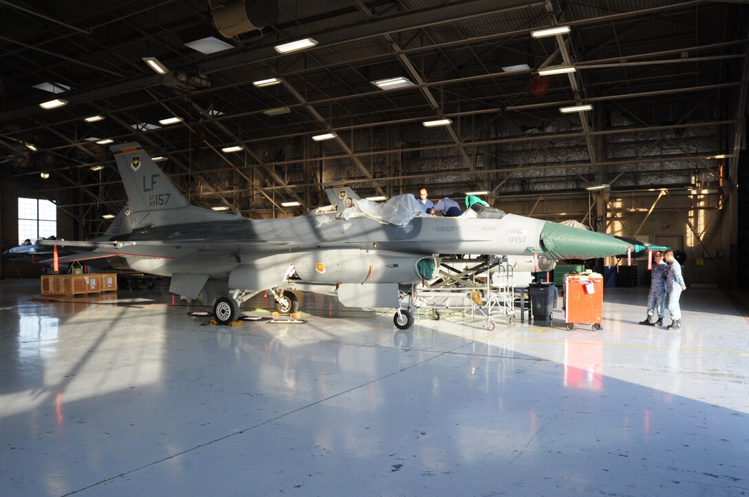 An F-16D Fighting Falcon undergoes repairs to the longeron due to cracks. This is one of the last aircraft to be repaired. (U.S. Air Force photo/Staff Sgt. Luther Mitchell Jr.)
