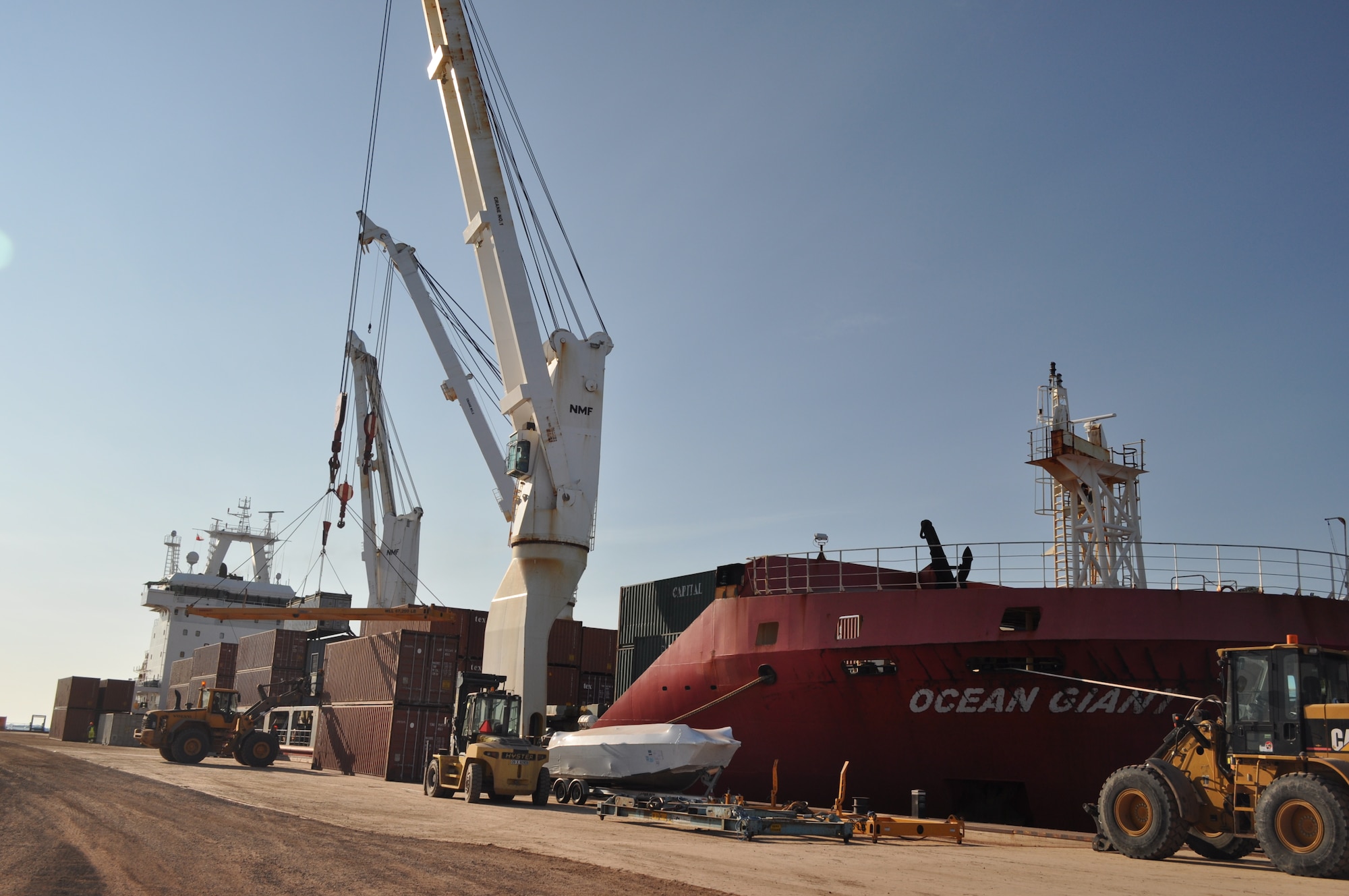 THULE AIR BASE, Greenland – Maintenance contractors work to unload The Ocean Giant cargo ship July 21, 2015, as part of the annual Operation PACER GOOSE mission, which resupplies the US military’s northernmost installation, Thule Air Base, Greenland. The base receives weekly resupply ships between June and mid-September. (U.S. Air Force photo by Lt. Col. Stacy M. Clements)