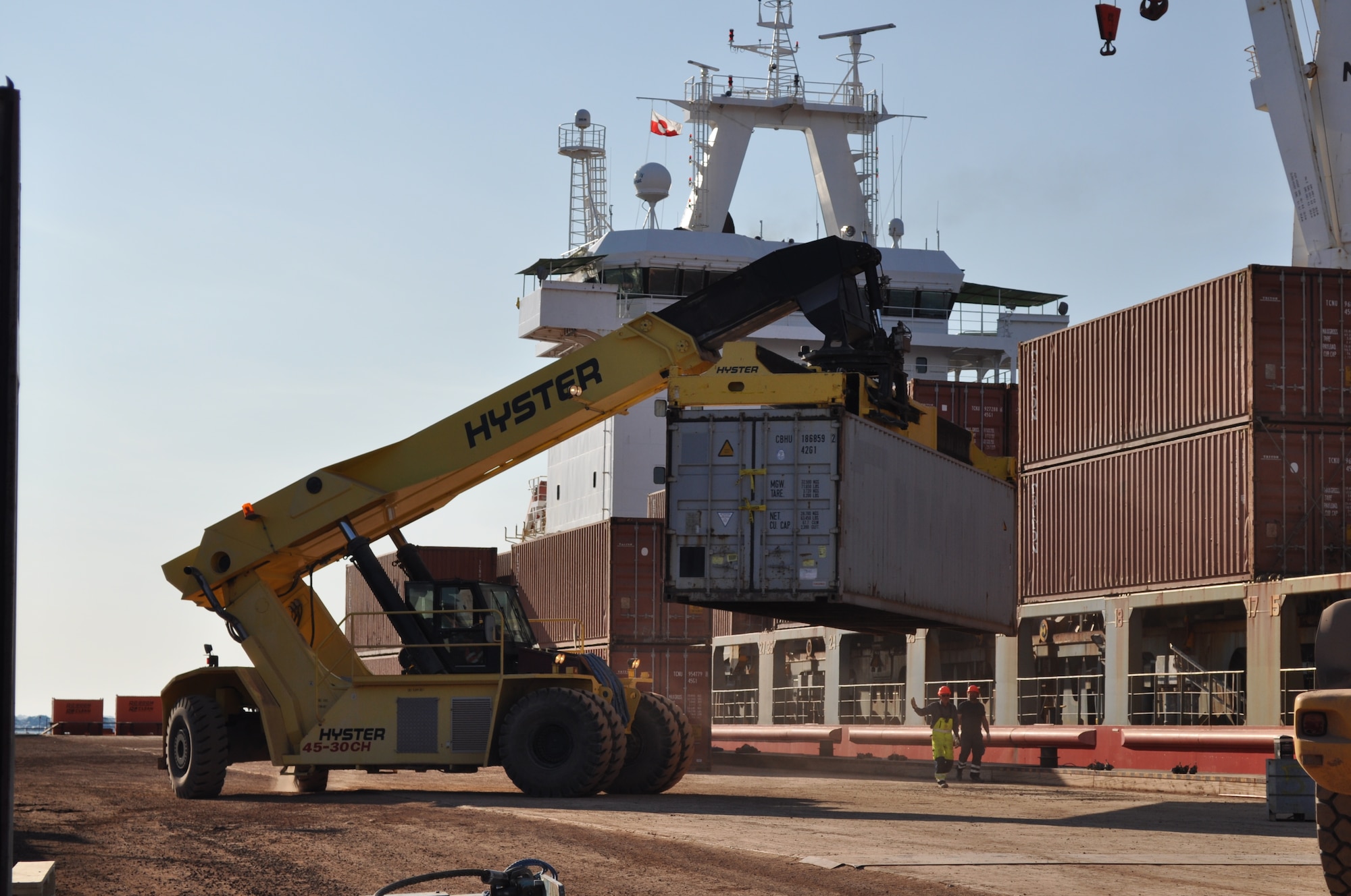 THULE AIR BASE, Greenland - Maintenance Contractors work with the Ocean Giant’s crew to offload and deliver supplies and equipment for Thule Air Base on July 21, 2015.  The base receives approximately 90 percent of its yearly supplies on ships like the Ocean Giant during the summer. (U.S. Air Force photo by Lt. Col. Stacy M. Clements)