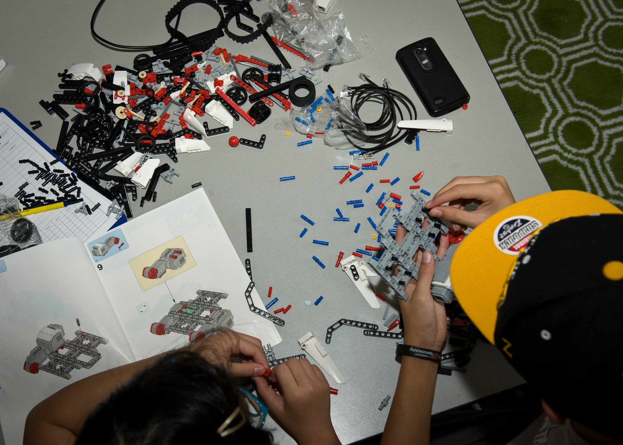PETERSON AIR FORCE BASE, Colo. – Minhtam Thai, 10, and Jose Nunez, 12, create a robot based on the directions given to them and the knowledge learned during the week-long STEM camp at the R.P. Lee Youth Center, July 21, 2015. The camp was designed to help kids expand their knowledge in subjects they may not get during the school and possibly find new hobbies or interests. The camp was held July 20-24. (U.S. Air Force photo by Airman 1st Class Rose Gudex)