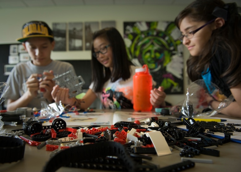 PETERSON AIR FORCE BASE, Colo. – Using only a simple set of directions and the tools provided, kids built a robot after learning about robotics during the STEM Camp held at the R.P. Lee Youth Center, July 21, 2015. The Science, Technology, Engineering and Mathematics subjects were the base of everything taught throughout the week-long camp, in which kids learned new material and then used their hands to build projects based upon their new knowledge. (U.S. Air Force photo by Airman 1st Class Rose Gudex)