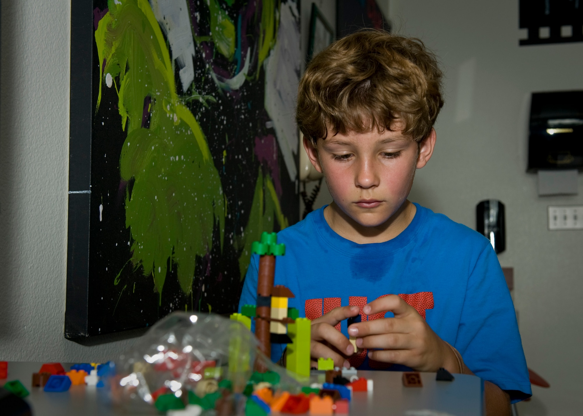 PETERSON AIR FORCE BASE, Colo. – Shelton Krasinski, 10, uses newly acquired engineering knowledge to build a working swing out of Legos during a STEM camp at the R.P. Lee Youth Center, July 21, 2015. This is the first year the Science, Technology, Engineering and Mathematics Camp was offered, which was designed for kids to get a chance to learn about STEM as use their hands to build a project based off what was learned. The camp was from July 20-24. (U.S. Air Force photo by Airman 1st Class Rose Gudex)