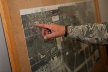 Members of the 5th Logistics Readiness Squadron show Lt. Col. Jamaal Mays, 5th LRS commander, a map of Minot Air Force Base, N.D., with fuel pipelines highlighted for current and future projects, July 21, 2015. Mays said the new pipeline is a “win” for the environment and team Minot. (U.S. Air Force photo/Airman 1st Class Christian Sullivan)