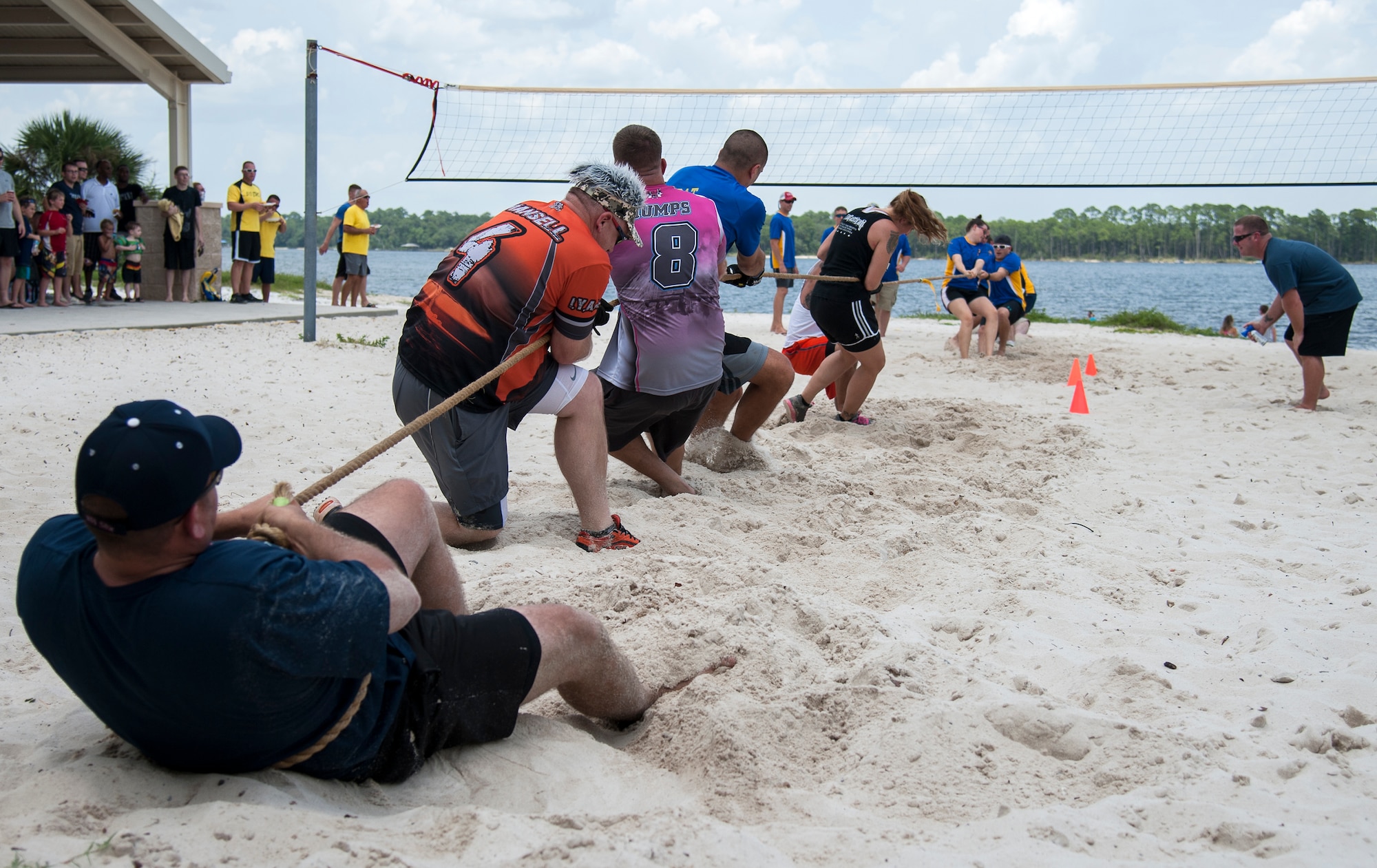 53rd Wing teams battle in a tug-of-war test of strength during the wing’s annual picnic and sports day July 24 at Post’l Point on Eglin Air Force Base, Fla. The annual event featured several team sports, physical fitness challenges, a military working dog demonstration, music, lunch, kayak races and an awards ceremony. (U.S. Air Force photo/Ilka Cole)