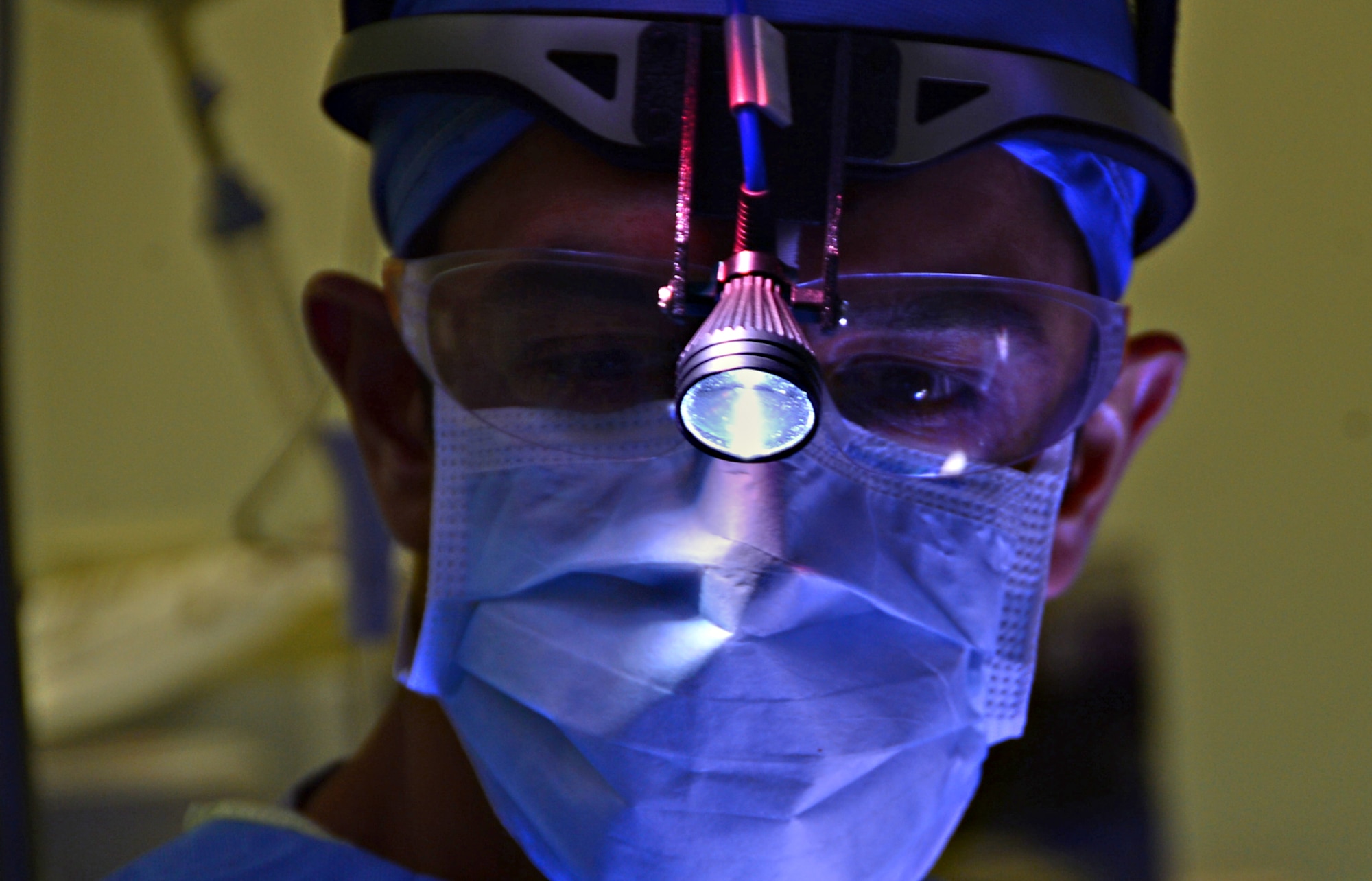 Lt. Col. Khurram Shahzad, 48th Dental Squadron oral maxillofacial surgeon, performs a surgery in the hospital at Royal Air Force Lakenheath, England, July 9, 2015. Maxillofacial surgeons perform the tasks of both plastic surgeons and dentists and perform hundreds of surgeries each year. (U.S. Air Force photo by Senior Airman Erin O’Shea/Released)