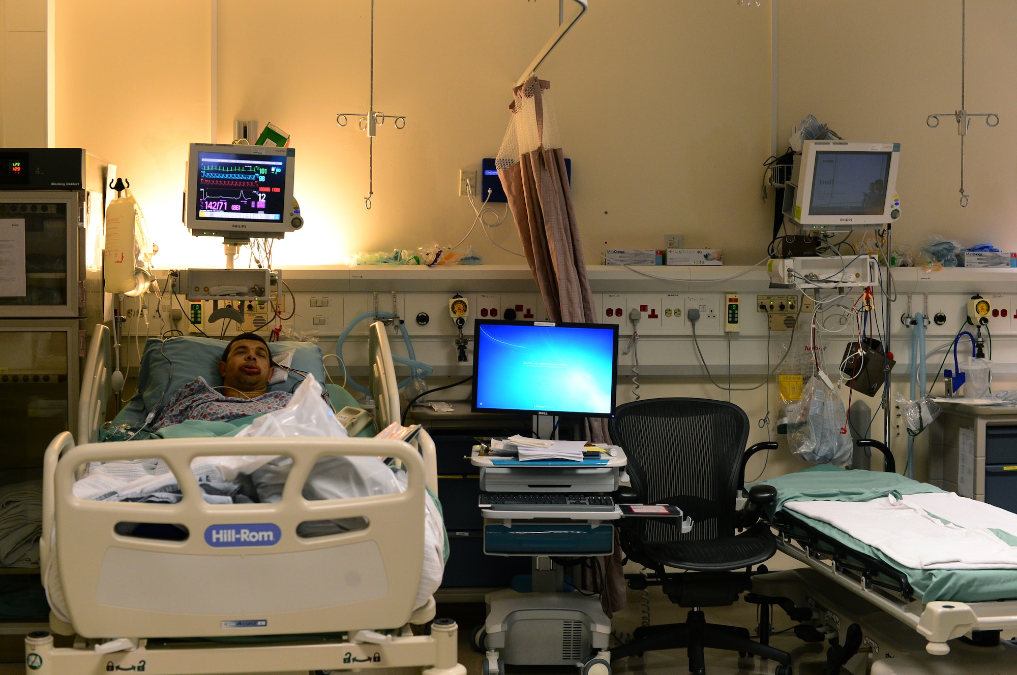 Senior Airman Trevor McBride, 48th Fighter Wing Public Affairs photojournalist, recovers after orthognathic facial surgery in the hospital at Royal Air Force Lakenheath, England, July 9, 2015. The procedure is performed to correct jaw and facial conditions, which can affect breathing, induce sleep apnea and cause difficulty eating. (U.S. Air Force photo by Senior Airman Erin O’Shea/Released)