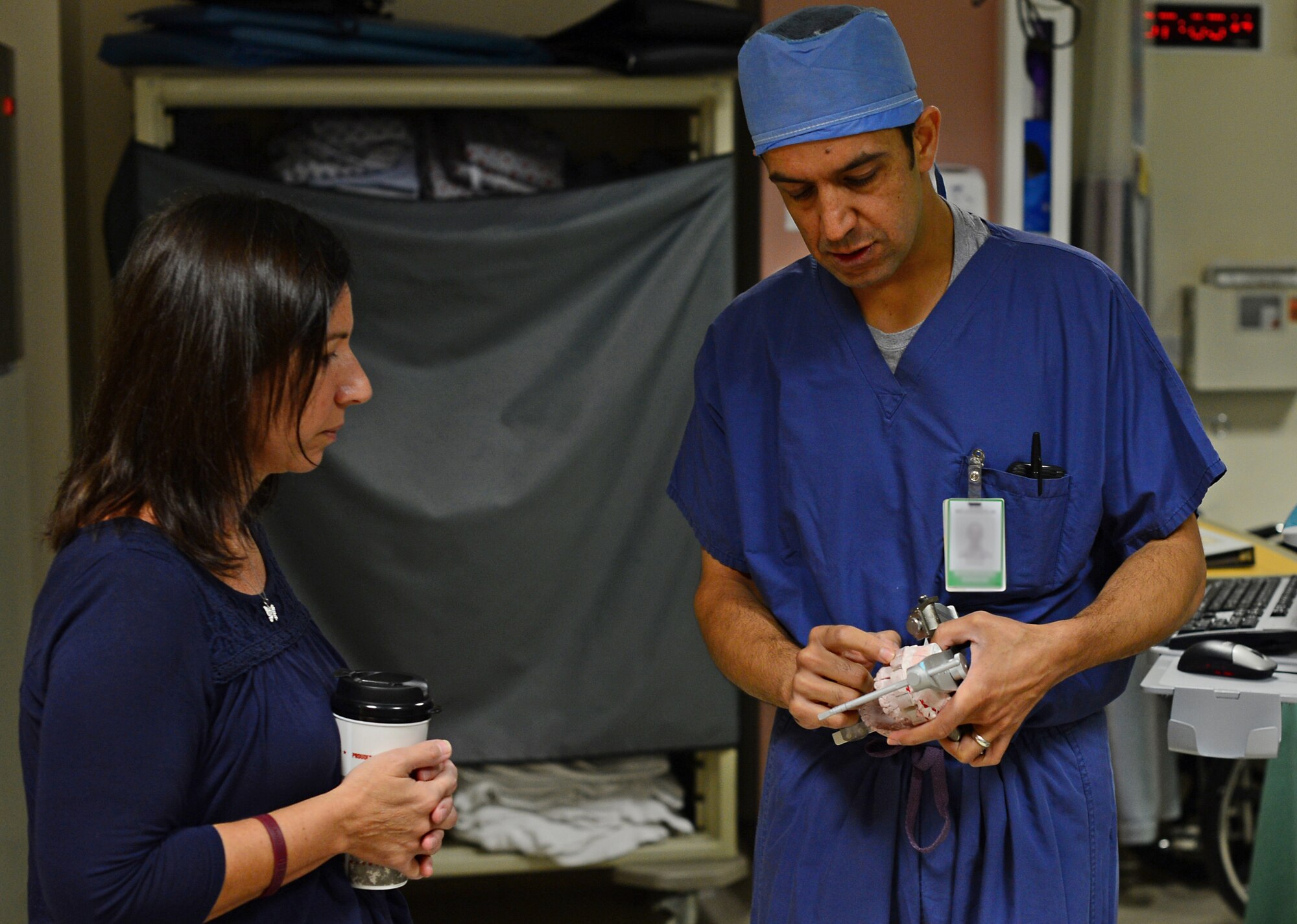 Lt. Col. Khurram Shahzad, 48th Dental Squadron oral maxillofacial surgeon, shows a jaw anatomy model to Dawn McBride, the mother of a patient undergoing dental facial defomrity surgery, in the hospital at Royal Air Force Lakenheath, England, July 9, 2015. Maxillofacial surgeons perform the tasks of both plastic surgeons and dentists, and perform hundreds of surgeries each year. (U.S. Air Force photo by Senior Airman Erin O’Shea/Released) 