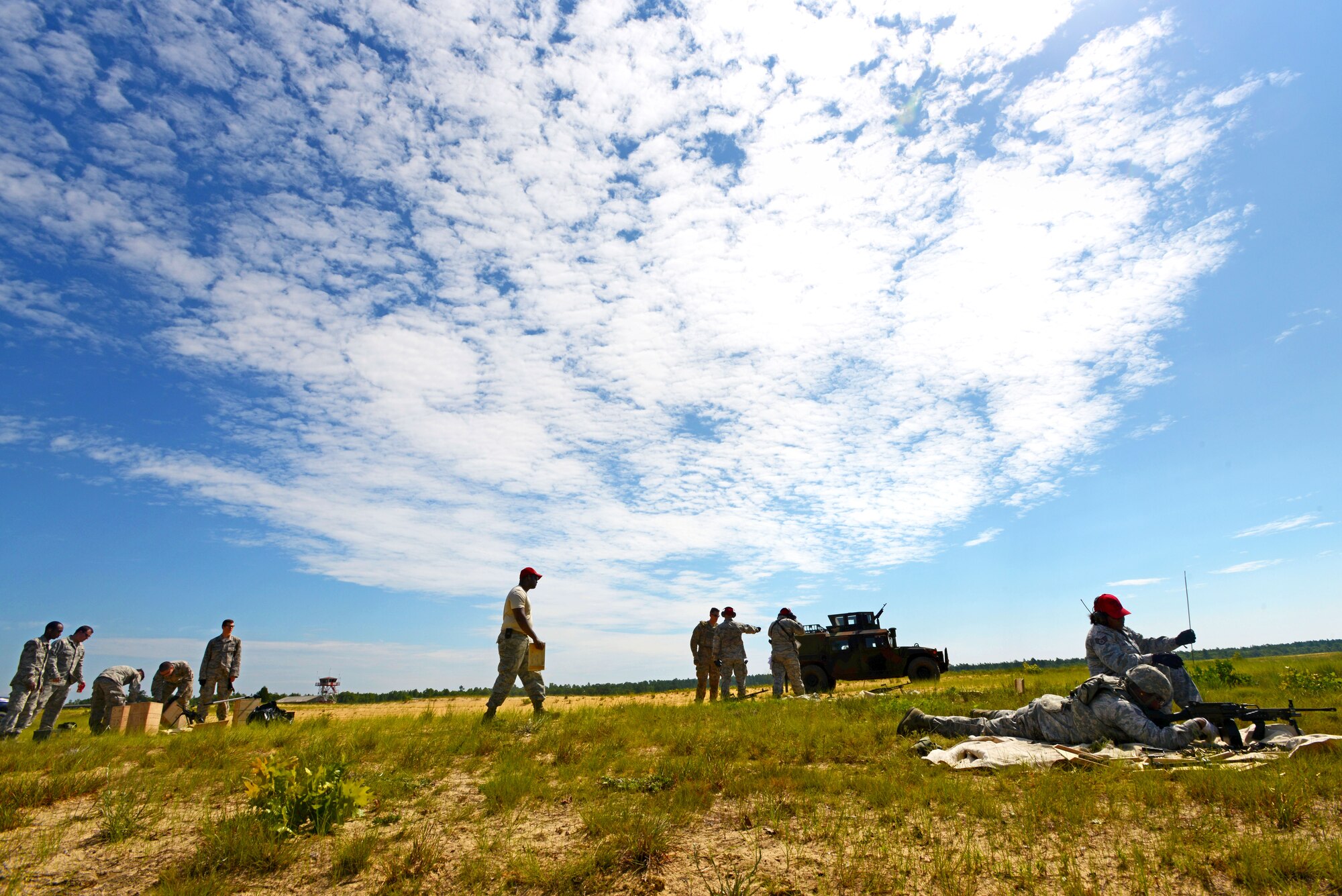 Airmen assigned to the 20th Security Forces Squadron conduct weapons training at Poinsett Electronic Combat Range in Wedgefield S.C., July 23, 2015. Members of the 20th SFS and 20th Civil Engineer Squadron received refresher training on the M249 and M240 to satisfy pre-deployment requirements. (U.S. Air Force photo by Senior Airman Jensen Stidham/Released) 