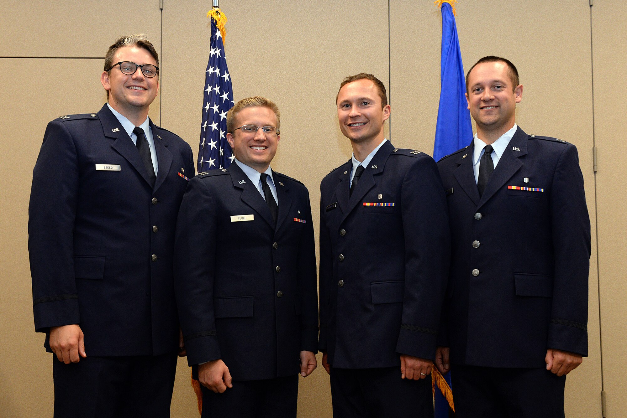 (From left) Capts. Jeffrey Steed, Clayte Fluke, Tomasz Charowski, and Andrew Price pose for a photo on Barksdale Air Force Base, La., July 24, 2015. The dental Airmen graduated from Barksdale’s Advanced Education in General Dentistry residency program, a one-year, post-doctorate program designed to give newly-graduated dentists advanced training with board-certified dental specialists before they are sent to bases around the world. (U.S. Air Force photo/Airman 1st Class Curt Beach)