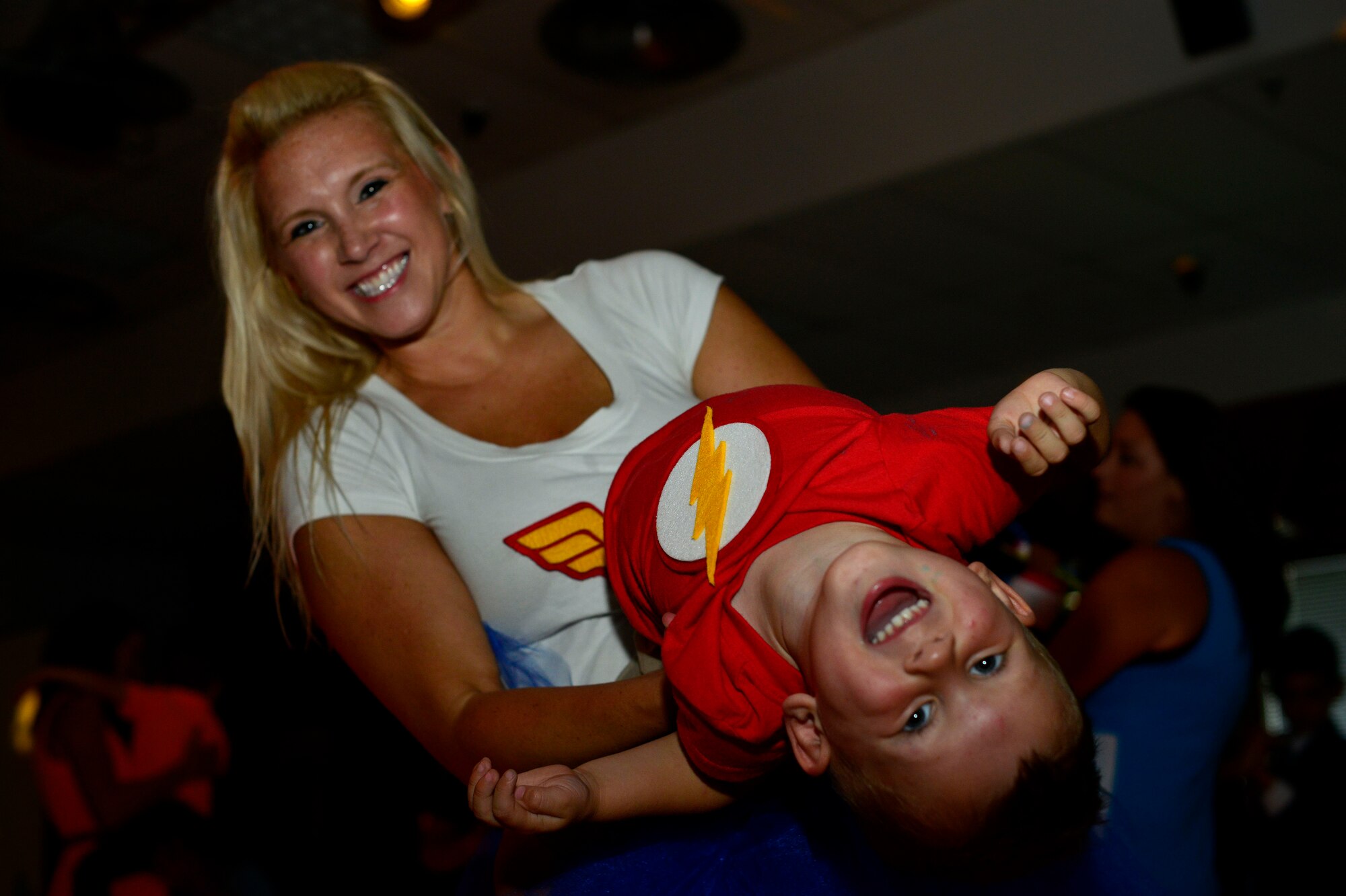 Shena Alexander and her son, Beau Alexander, dance together during the first “Mother and Son dance,” July 25, 2015, at Aviano Air Base, Italy. Attendees were encouraged to dress up in their favorite superhero outfit for the dance. (U.S. Air Force photo by Airman 1st Class Cary Smith/Released)