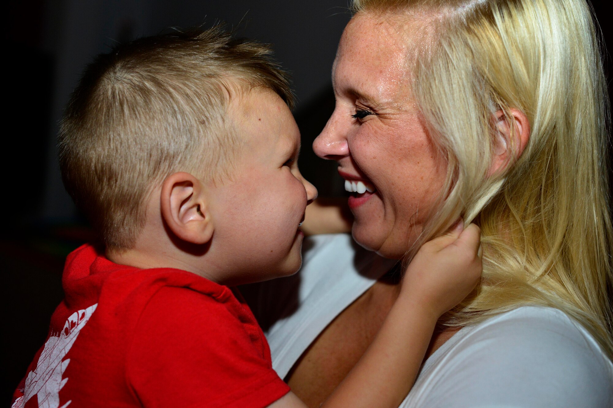 Shena Alexander and her son, Beau Alexander, dance together during the first “Mother and Son dance,” July 25, 2015, at Aviano Air Base, Italy. Attendees were encouraged to dress up in their favorite superhero outfit for the dance. (U.S. Air Force photo by Airman 1st Class Cary Smith/Released)