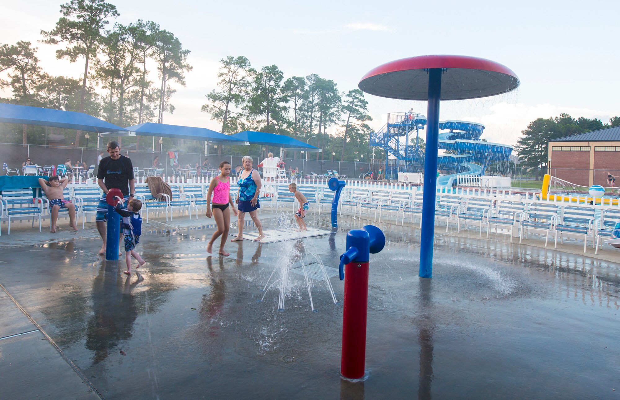 Attendees play in the pool during the Exceptional Family Member Program deployed and remote family pool party July 24, 2015, at Moody Air Force Base, Ga. The EFMP hosts events for deployed, remote and EFMP families quarterly. (U.S. Air Force photo by Airman 1st Class Ceaira Tinsley/Released)