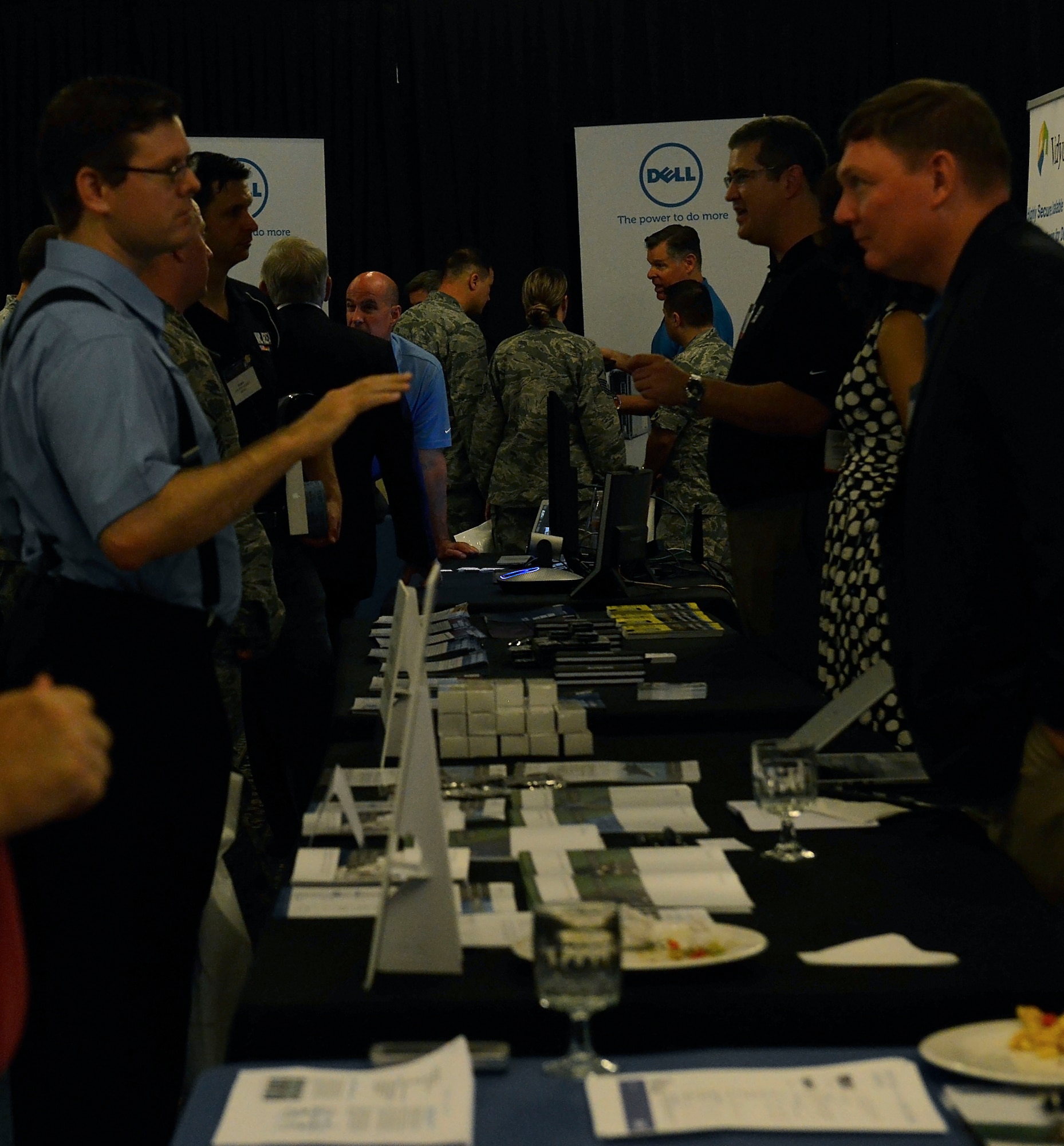 Airmen and civilians attend the Armed Forces Communications-Electronics Association’s Technology Exposition July 20, 2015, at Ramstein Air Base, Germany. Over 65 companies participated in the two-day event to show the technologies available that may aid the military in completing their mission. (U.S. Air Force photo/Airman 1st Class Tryphena Mayhugh)