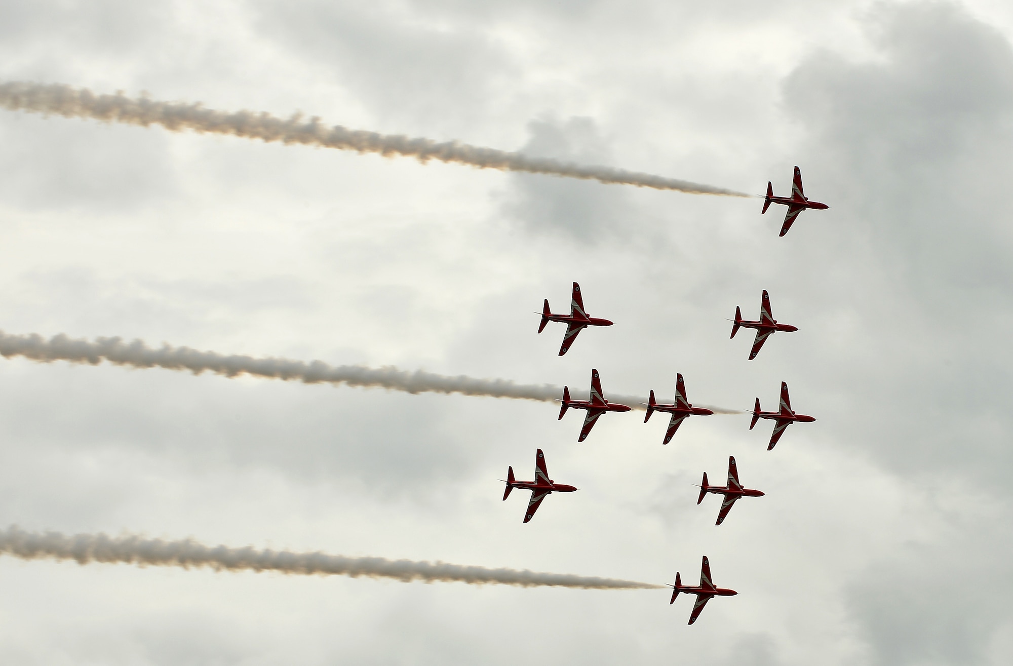 The Royal Air Force Red Arrows Acrobatic Team perform during the Families and Friends Day at RAF Marham, England, July 23, 2015. The event celebrated the 75th Battle of Britain anniversary and welcomed Airmen from RAFs Marham, Lakenheath and Mildenhall, as well as their families and local dignitaries to enjoy a day off. (U.S. Air Force photo by Staff Sgt. Stephanie Longoria/Released)