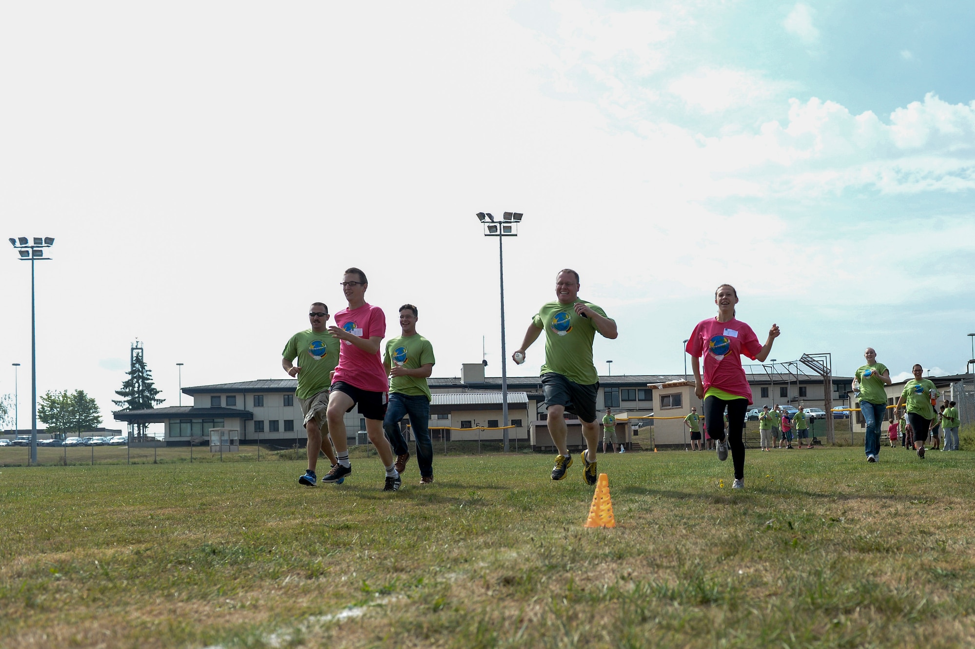 Students and their volunteers race in the 100-meter dash as part of St Martin’s Special Children’s Day July 22, 2015 at Spangdahlem Air Base, Germany. The event offered numerous games and sports for nearly 100 special needs youth. (US Air Force photo by Senior Airman Sarah Denewellis/Released)
