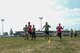 Students and their volunteers race in the 100-meter dash as part of St Martin’s Special Children’s Day July 22, 2015 at Spangdahlem Air Base, Germany. The event offered numerous games and sports for nearly 100 special needs youth. (US Air Force photo by Senior Airman Sarah Denewellis/Released)