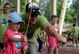 A volunteer instructs a child on how to play a game during the St. Martin’s Special Children’s Day event July 22, 2015 at Spangdahlem Air Base, Germany. Two volunteers guide each child through each event as part of the day’s events. (US Air Force photo by Senior Airman Sarah Denewellis/Released)