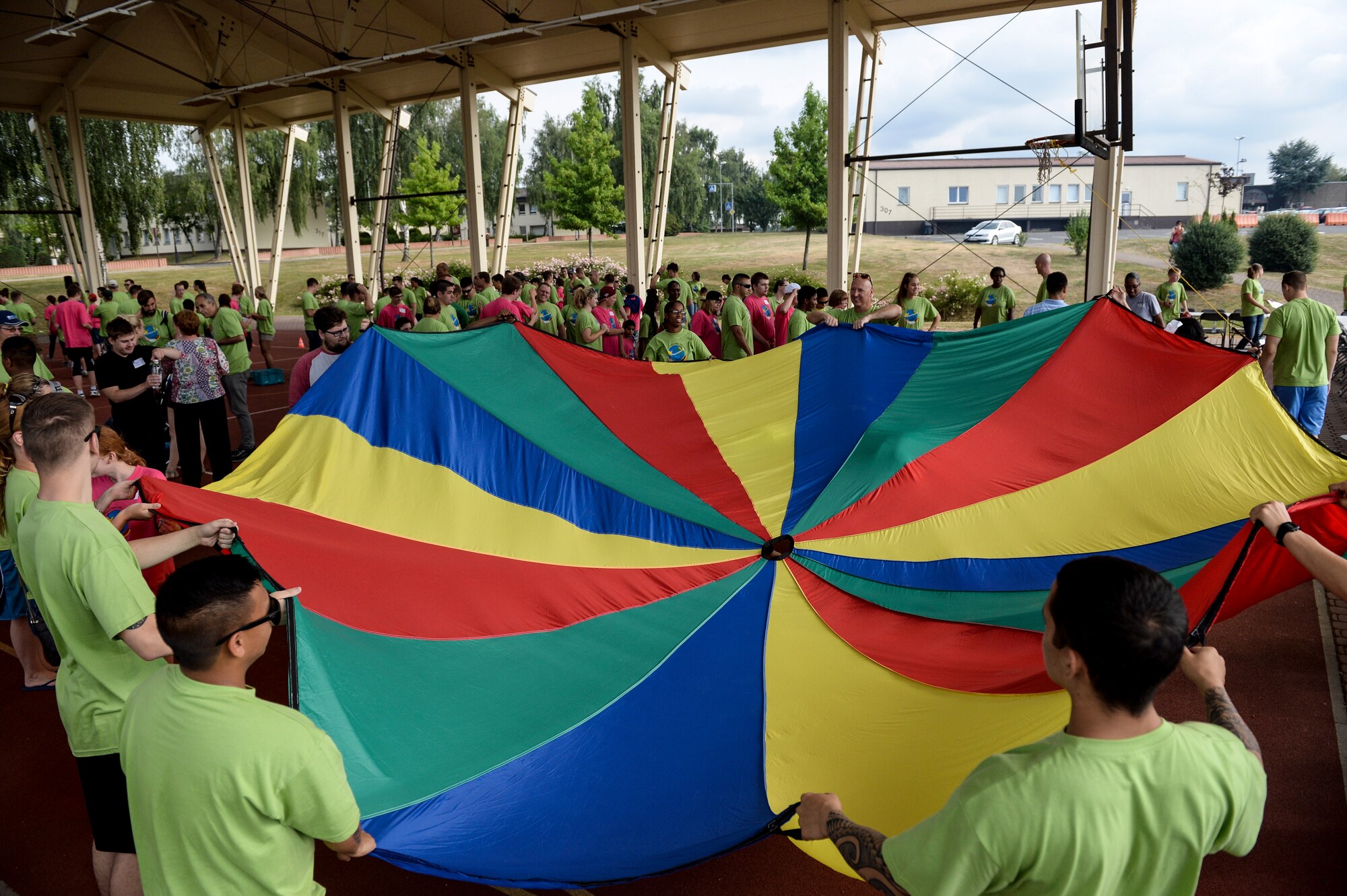 Volunteers from the Spangdahlem community play alongside children from a local school as part of St. Martin’s Special Children’s Day event July 22, 2015 at Spangdahlem Air Base, Germany. The event originated at Spangdahlem in 1992. (US Air Force photo by Senior Airman Sarah Denewellis/Released)