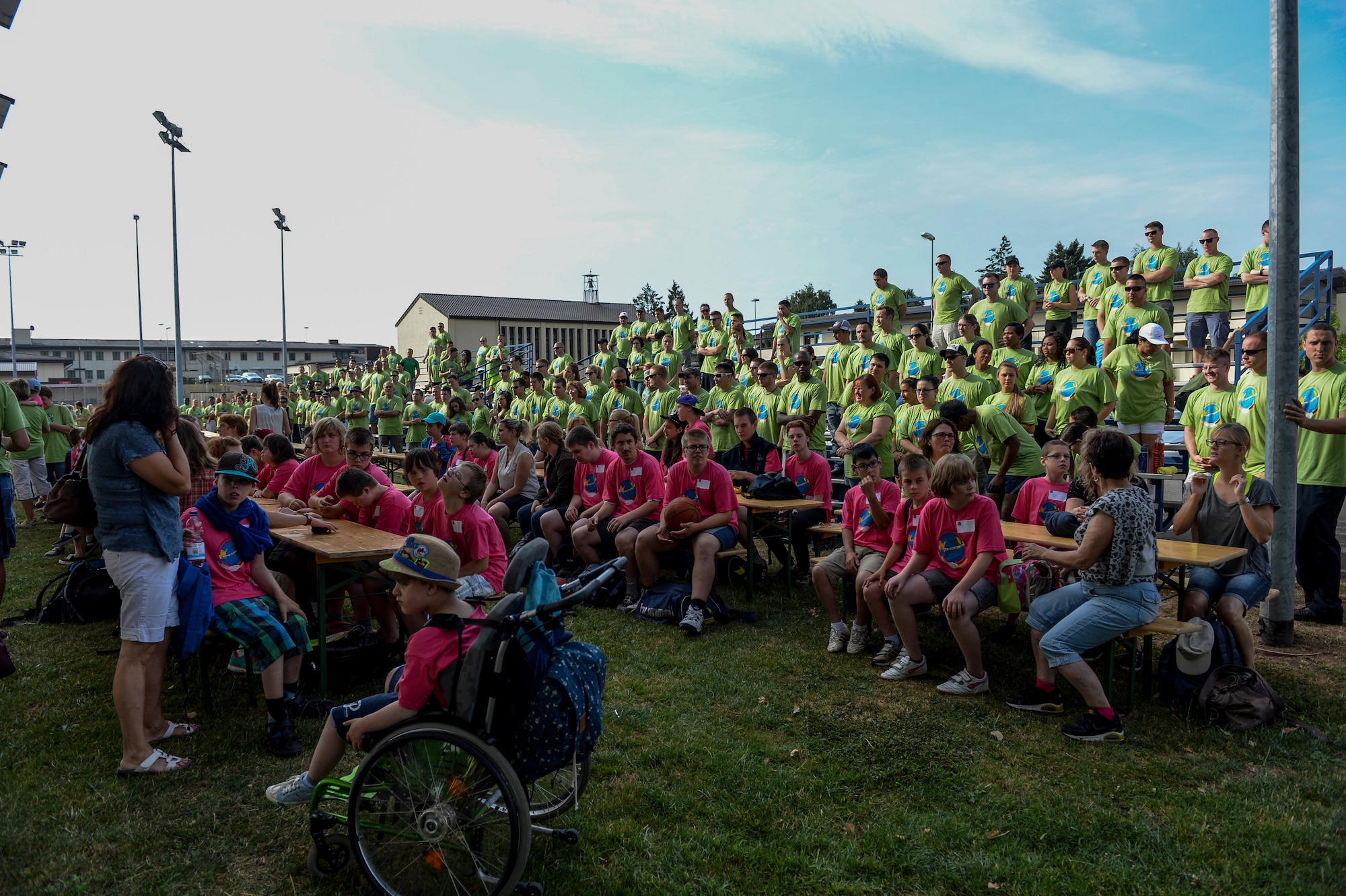 Volunteers gather to welcome children to the St. Martin’s Special Children’s Day event July 22, 2015 at Spangdahlem Air Base, Germany. Nearly 100 special needs students from a local school took part in the event. (US Air Force photo by Senior Airman Sarah Denewellis/Released)