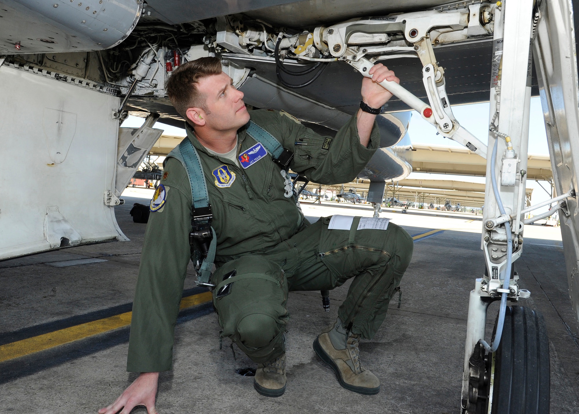 Maj. Jay Pease, 39th Flying Training Squadron instructor pilot, performs a pre-flight check on a T-38 Talon aircraft at Joint Base San Antonio-Randolph, Texas. Members of the 39th play a key role in the instructor pilot training mission by providing both manpower and experience. (Harold China)