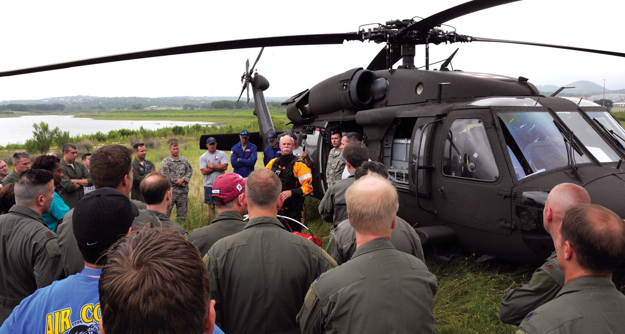 Ken Larsen, Texas Task Force 1 helicopter rescue swimmer, gives a safety briefing to members of the 39th FTS before a training event at Canyon Lake, Texas. The training event included a downed pilot scenario, and all the members of the 39th FTS took turns being extracted out of the lake via helicopter. (Staff Sgt. Sarah Hanson)