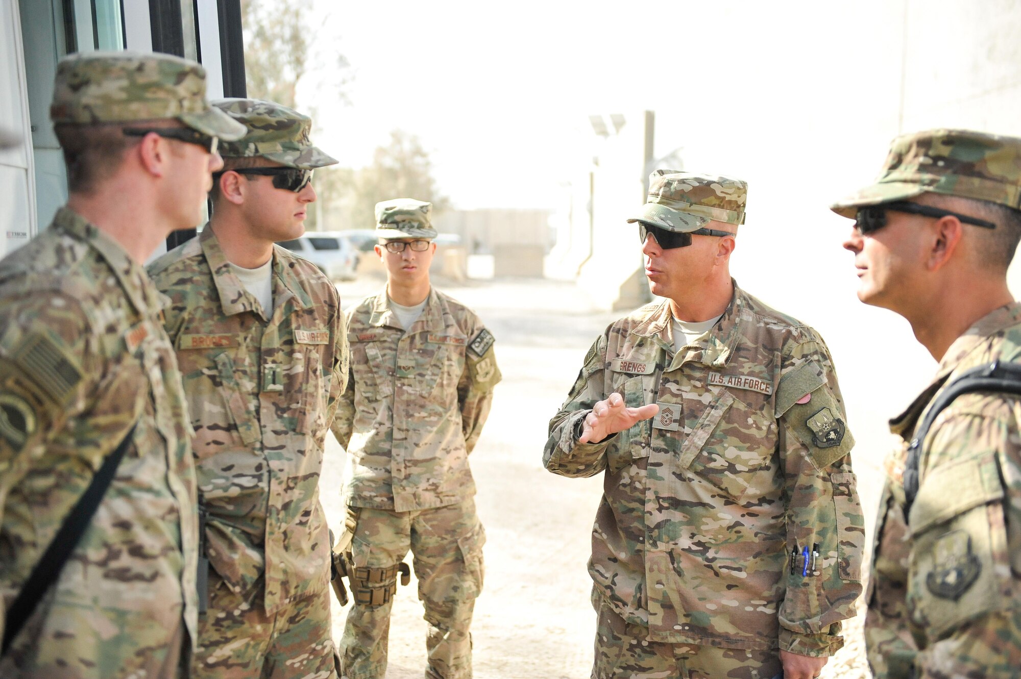 U.S. Air Force Brig. Gen. Dave Julazadeh, 455th Air Expeditionary Wing commander, and Chief Master Sgt. Matt Grengs, 455th AEW command chief talk with Airmen assigned to the 451st Air Expeditionary Group at Kandahar Airfield, July 25, 2015. The general and chief met with Airmen from across the group who provide intelligence, surveillance and reconnaissance for U.S. and Coalition forces operating outside the wire while also operating one of the busiest airfields in the theater.  (U.S. Air Force photo by Maj. Tony Wickman/Released)