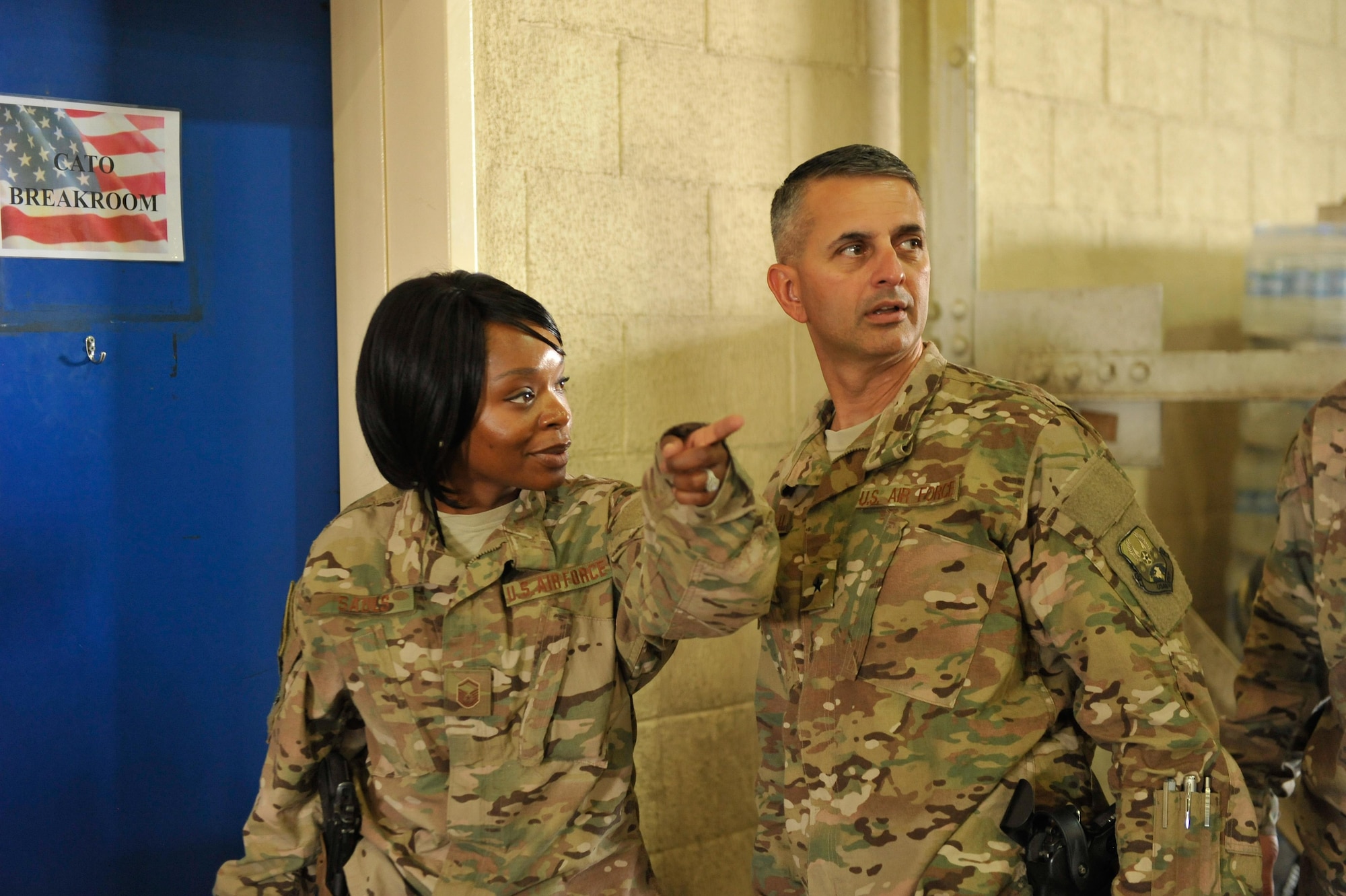 U.S. Air Force Brig. Gen. Dave Julazadeh, 455th Air Expeditionary Wing commander, talks with an Airman assigned to the 451st Air Expeditionary Group at Kandahar Airfield, July 25, 2015. The general and Chief Master Sgt. Matt Grengs, 455th AEW command chief ,met with Airmen from across the group who provide intelligence, surveillance and reconnaissance for U.S. and Coalition forces operating outside the wire while also operating one of the busiest airfields in the theater.  (U.S. Air Force photo by Maj. Tony Wickman/Released)