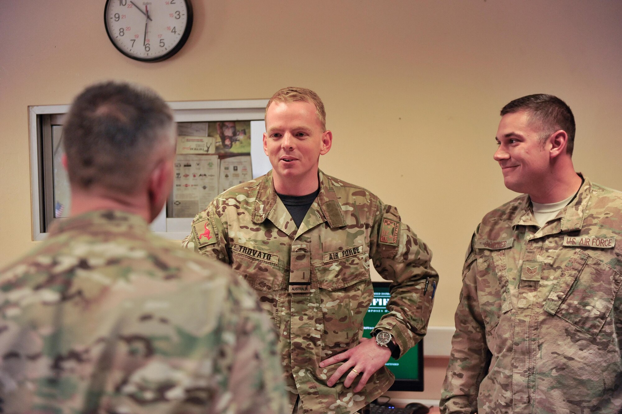 U.S. Air Force Brig. Gen. Dave Julazadeh, 455th Air Expeditionary Wing commander, talks with an Airman assigned to the 451st Air Expeditionary Group and a Royal Australian Air Force member at Kandahar Airfield, July 25, 2015. The general and Chief Master Sgt. Matt Grengs, 455th AEW command chief, met with Airmen from across the group who provide intelligence, surveillance and reconnaissance for U.S. and Coalition forces operating outside the wire while also operating one of the busiest airfields in the theater.  (U.S. Air Force photo by Maj. Tony Wickman/Released)