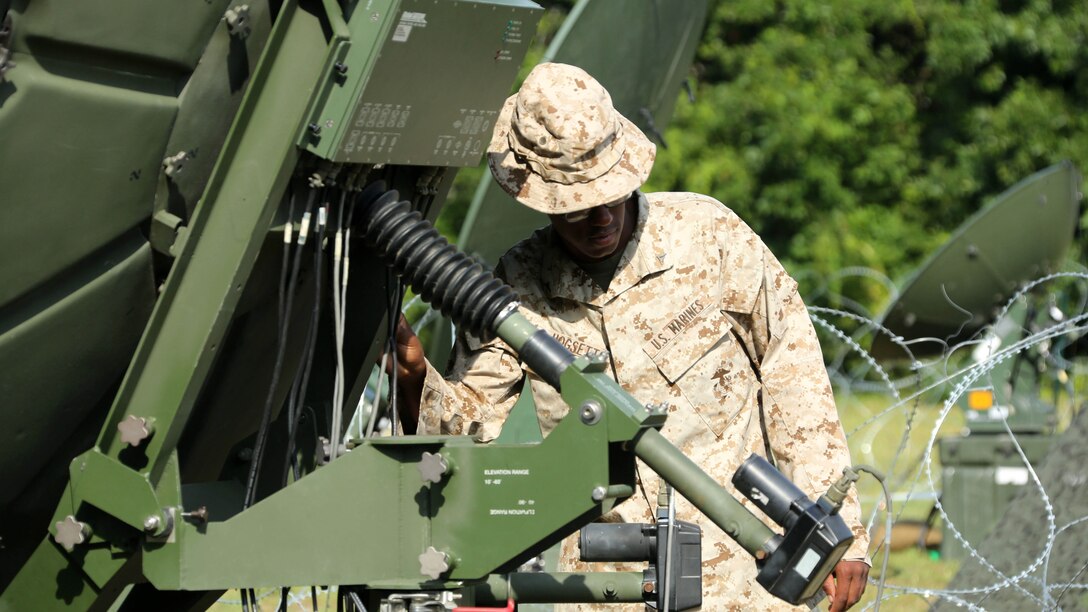 Lance Cpl. Frederick Hogsett measures the elevation of a satellite during a training exercise at Marine Corps Auxiliary Landing Field Bogue, North Carolina, July 23, 2015. Marines with MWHS-2, Marine Wing Support Squadron 274 and Marine Wing Communications Squadron 28 gathered at the airfield for a training exercise to simulate a deployed environment. Hogsett is an intelligence systems specialist with Marine Wing Headquarters Squadron 2.