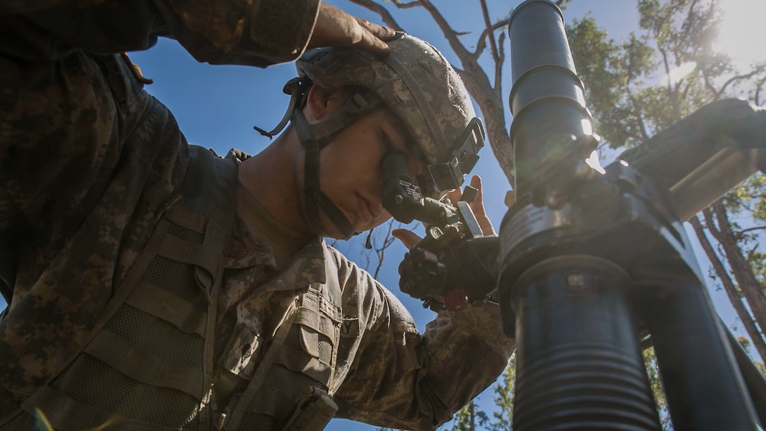 U.S. Army Spc. Ryan A. Van Rickley sets up a 61mm mortar in a defensive position after executing an aerial night assault July 13 in the Shoal Water Bay Training Area, Queensland, Australia, during Hamel 15 in conjunction with Talisman Sabre 15. Hamel is a combined arms exercise designed to improve U.S. and Australian relations. Van Rickley, from San Diego, California, is a mortarman with Charlie Company, 3-509th Airborne Infantry Battalion. 