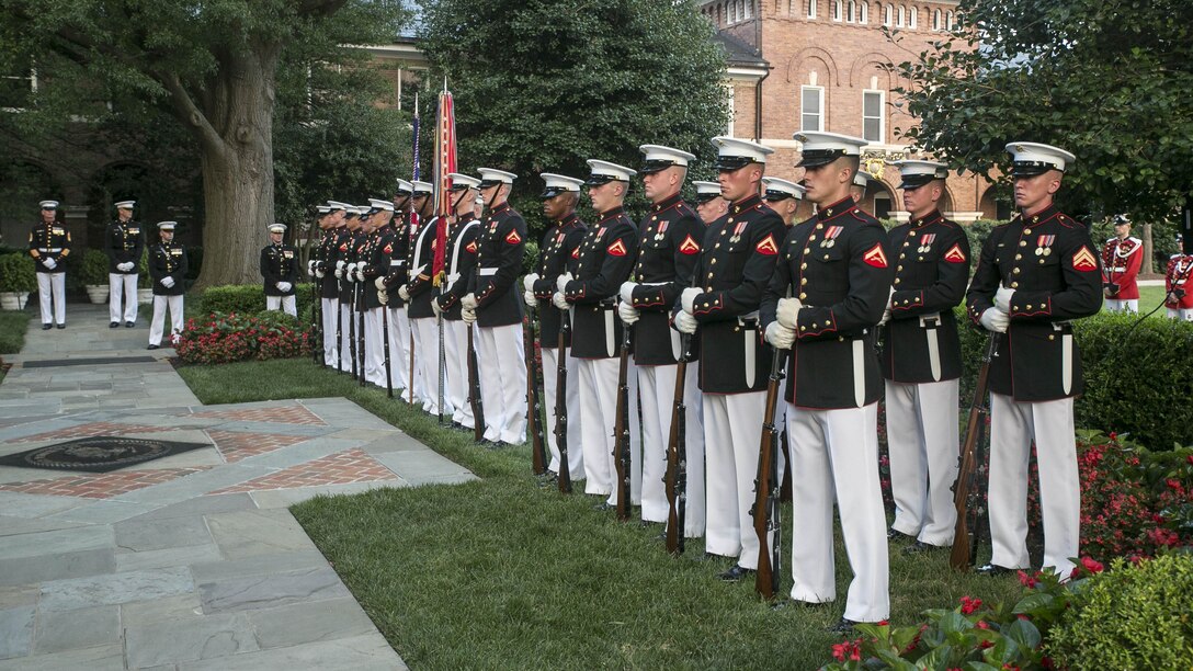 The Honor Guard stands at ceremonial at ease after an honors ceremony at the Home of the Commandants in Washington, D.C., July 27, 2015. During the ceremony Congressman Robert Wittman from the 1st Congressional District of Virginia, was named an Honorary Marine by Gen. Joseph Dunford Jr., commandant of the Marine Corps, for his extensive support of wounded warriors and his contributions to ensuring the readiness and care of active duty Marines and their families. We wanted to recognize Congressman Wittman tonight because of what he’s done for our wounded warriors behind the scenes, said Dunford. It hasn’t been with fanfare, it’s been because of his compassionate leadership.