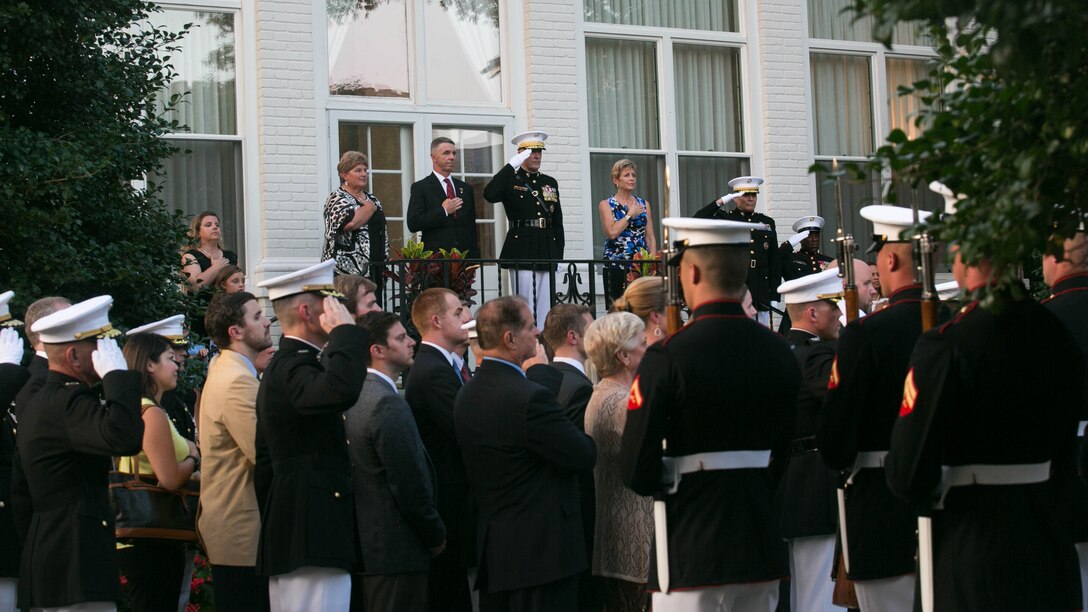 The Commandant of the Marine Corps, Gen. Joseph Dunford Jr. and Congressman Robert Wittman render honors during a backyard ceremony, July 27, 2015. During the honors ceremony at the Home of the Commandants in Washington, D.C., Wittman from the 1st Congressional District of Virginia, was named an Honorary Marine by Dunford for his extensive support of wounded warriors and his contributions to ensuring the readiness and care of active duty Marines and their families. We wanted to recognize Congressman Wittman tonight because of what he’s done for our wounded warriors behind the scenes, said Dunford. It hasn’t been with fanfare, it’s been because of his compassionate leadership. 