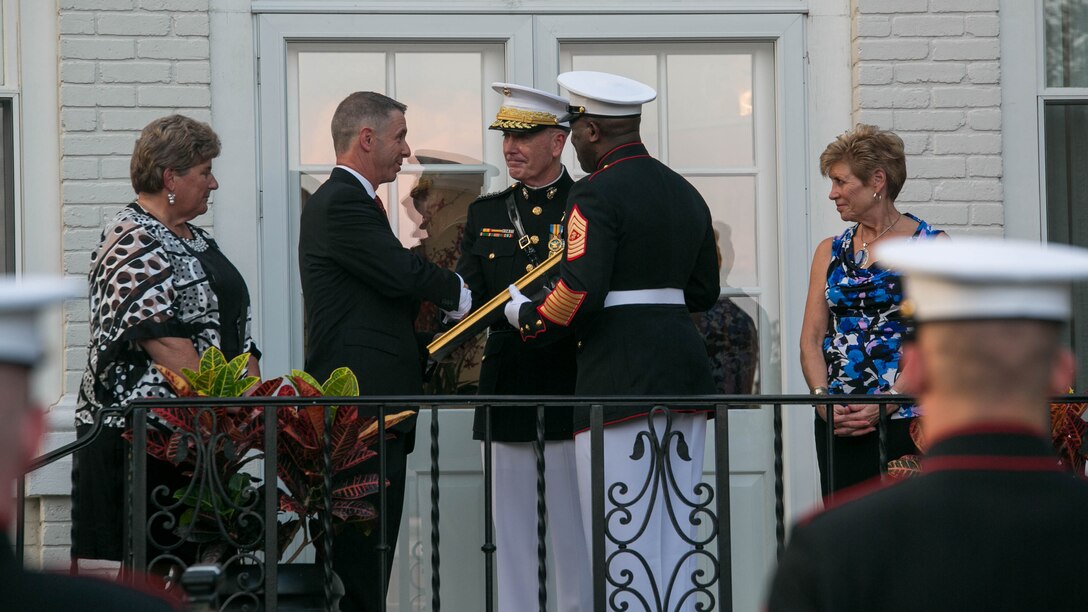 The Commandant of the Marine Corps, Gen. Joseph Dunford Jr. presents Congressman Robert Wittman with an Honorary Marine citation, July 27, 2015. During the honors ceremony at the Home of the Commandants in Washington, D.C., Wittman from the 1st Congressional District of Virginia, was named an Honorary Marine by Dunford for his extensive support of wounded warriors and his contributions to ensuring the readiness and care of active duty Marines and their families. We wanted to recognize Congressman Wittman tonight because of what he’s done for our wounded warriors behind the scenes, said Dunford. It hasn’t been with fanfare, it’s been because of his compassionate leadership. 