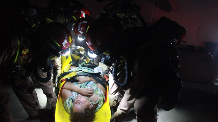 Marines from the Search and Extraction Platoon carried out a civilian role player with a crushed pelvis inside a subway station where a train had derailed during the 36-hour continuous operation as part of Exercise Scarlet Response 2015 at Guardian Centers in Perry, Georgia, July 23.  The Search and Extraction Platoon is the second team to go into a building after the primary assessment team, who gathers the first wave of intelligence that will be used to define the manner in which the mission will be accomplished. They search and extract victims that can’t move or are seriously injured. 