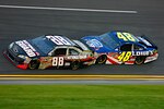 Dale Earnhardt Jr., driver of the No. 88 National Guard NASCAR racecar, ‘bump drafts’ with teammate Jimmie Johnson around the Daytona International Speedway in Daytona Beach, Fl. July 2, 2011. Earnhardt was caught up in a final lap wreck and crossed the finish line 19th.